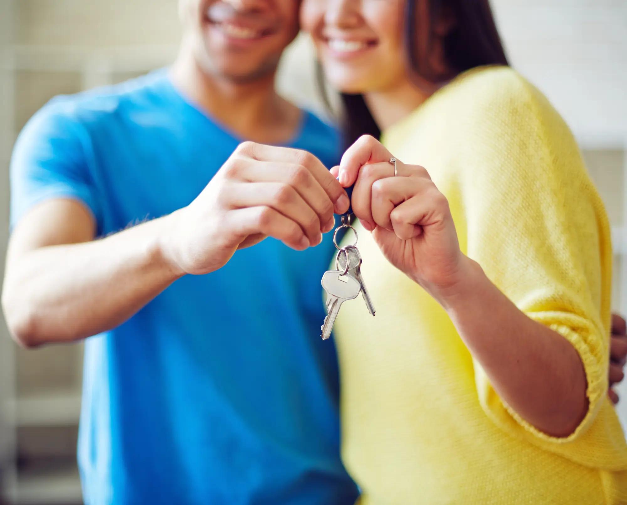 Couple holding house keys
