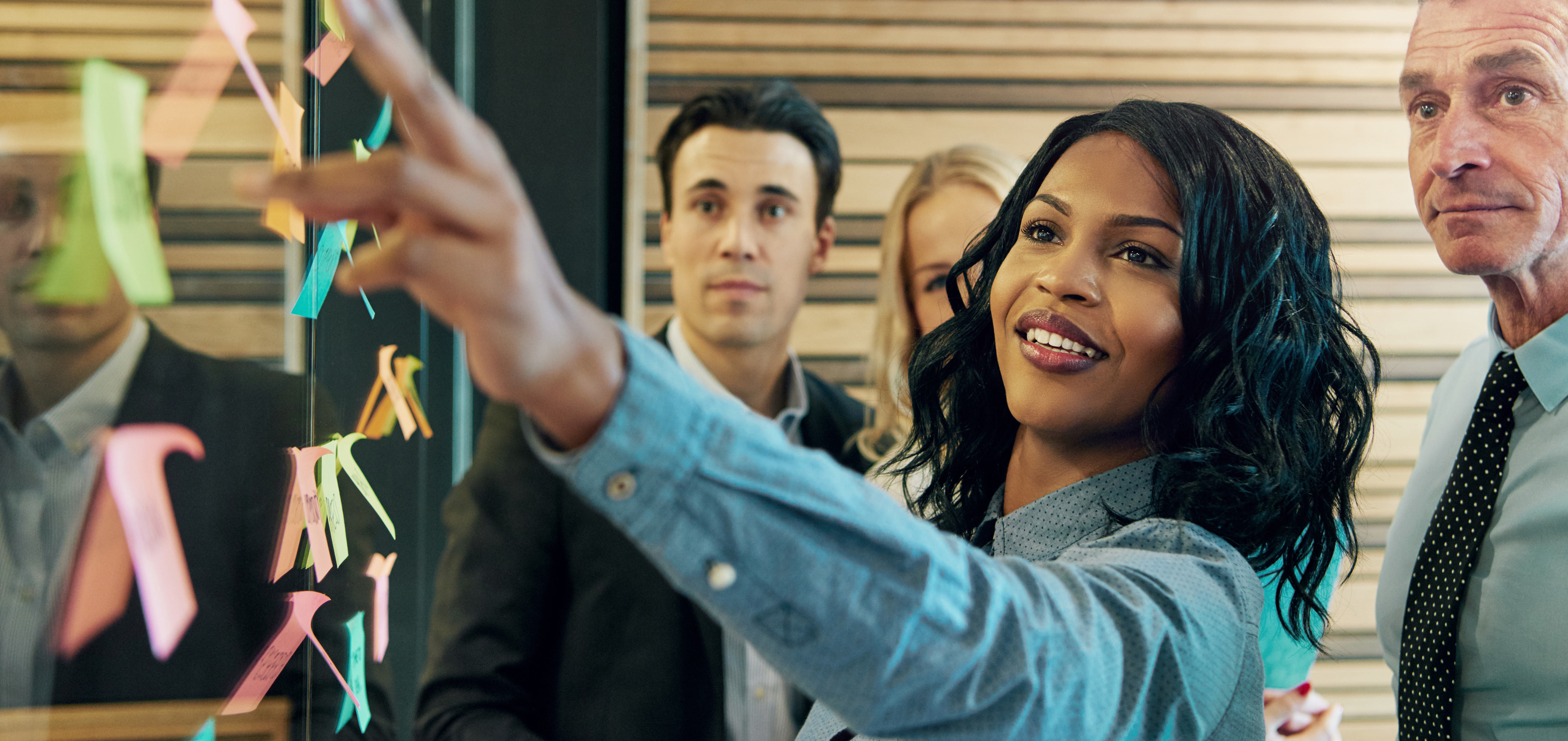 Woman explaining the plan to office team
