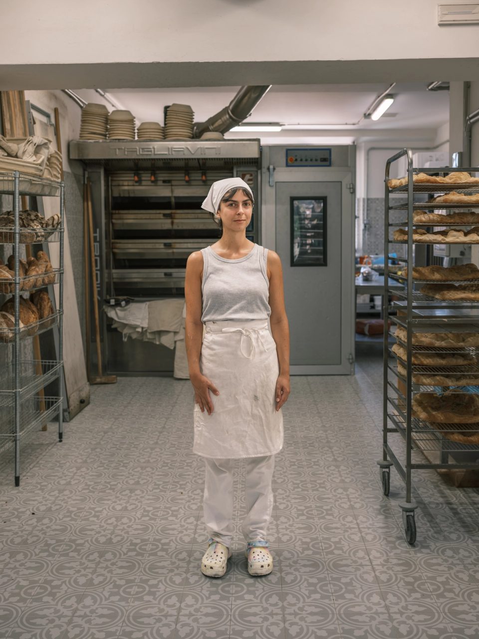 Baker standing inside a bakery
