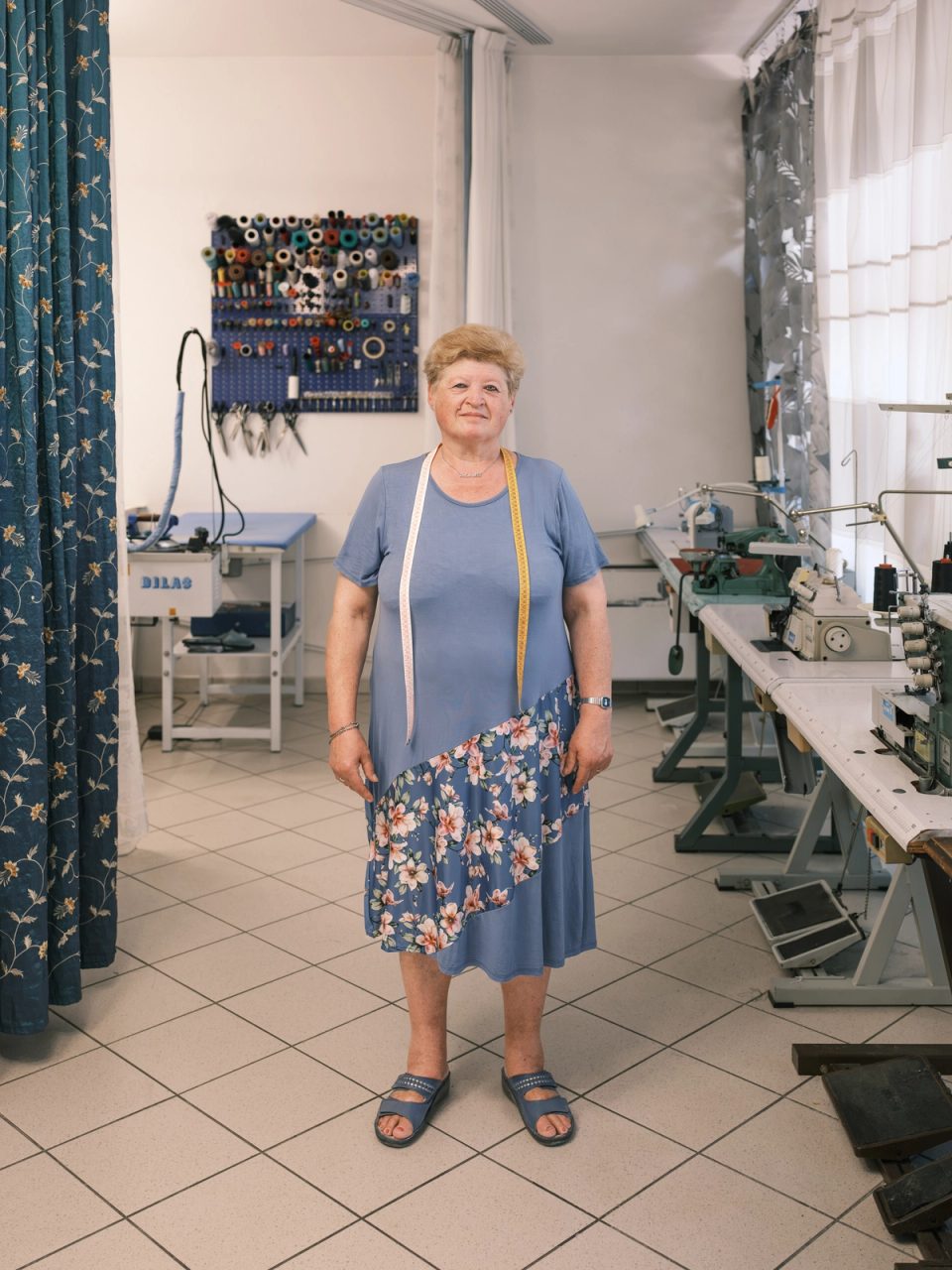 Seamstress standing in a sewing workshop