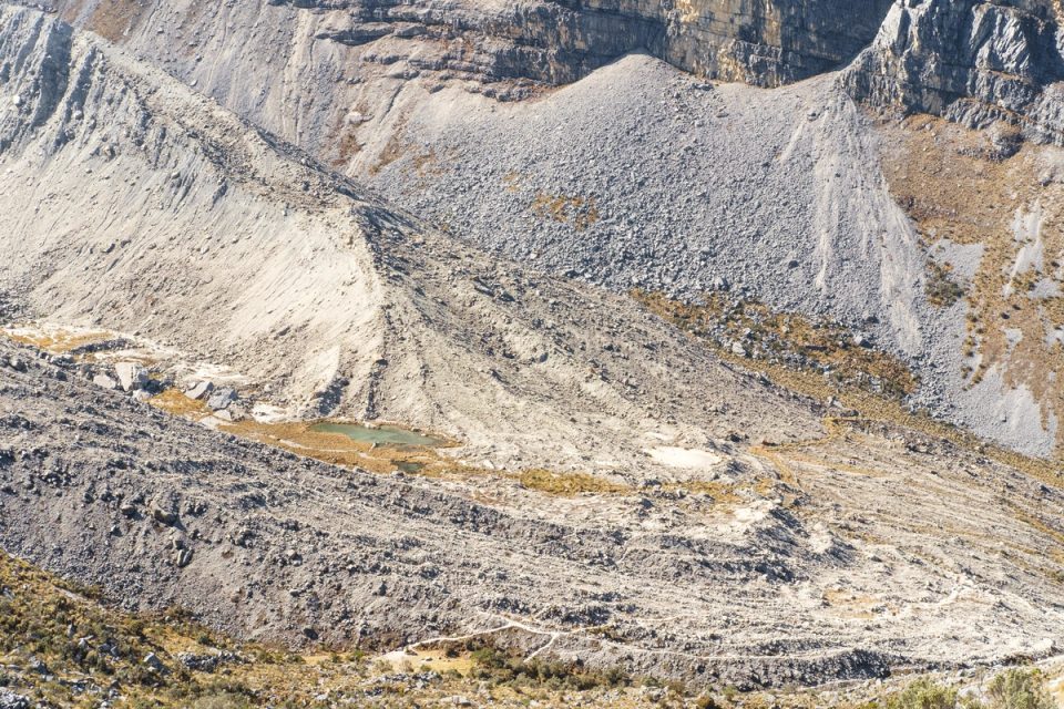 Rocky mountain slope with a winding road
