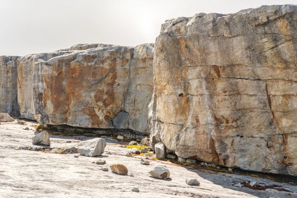 Large exposed rock face in a mountain landscape