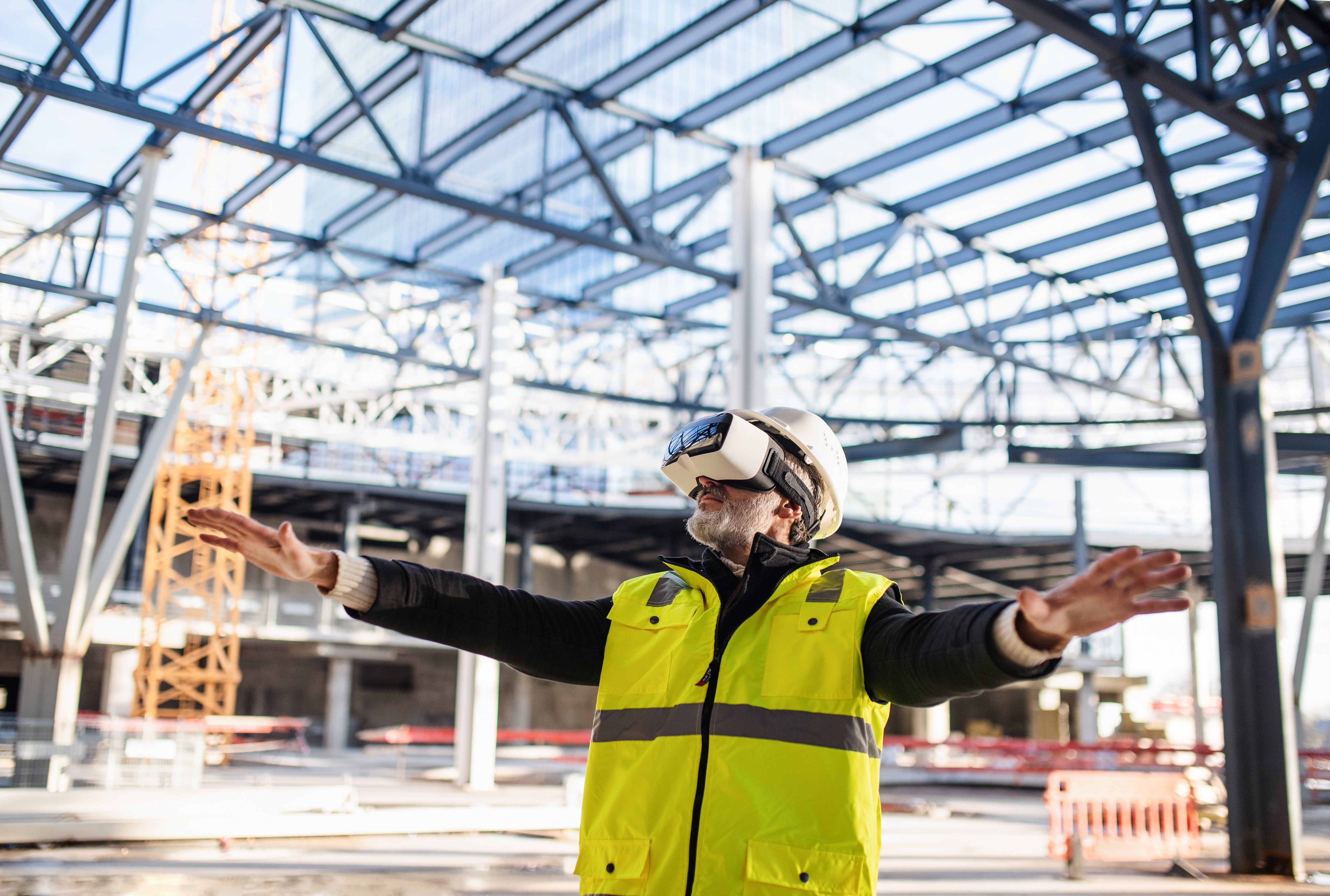 Construction worker with VR headset on site