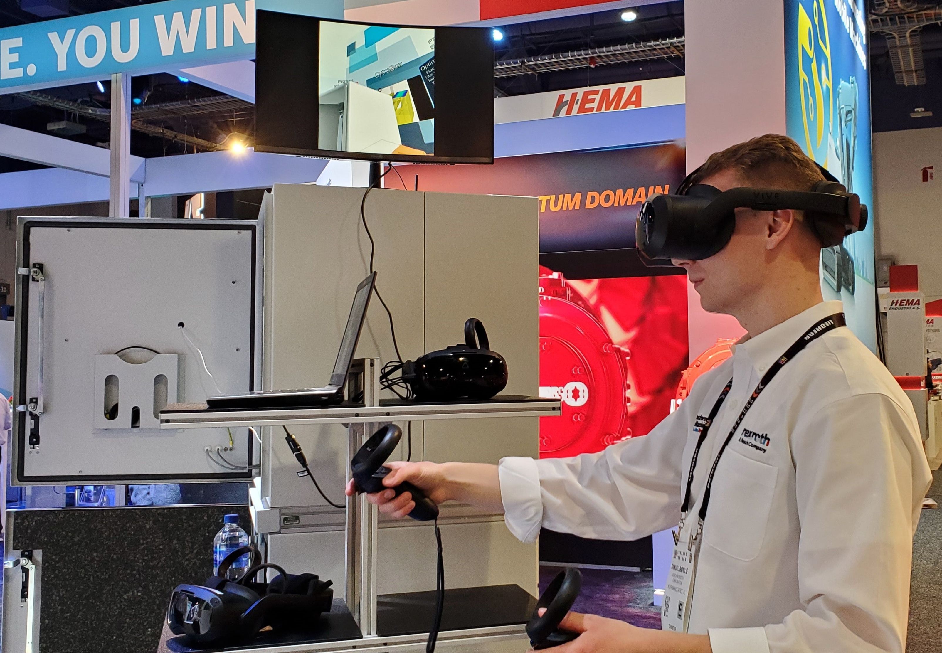 Person wearing a headset and using hand controllers