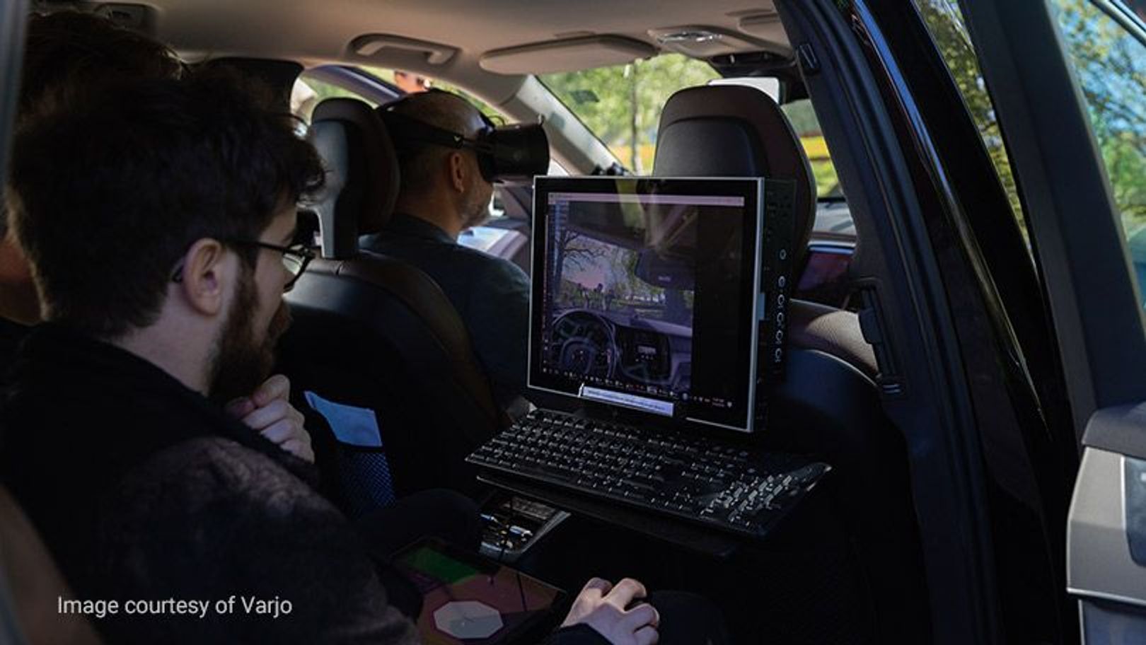 Engineers working inside a Volvo car