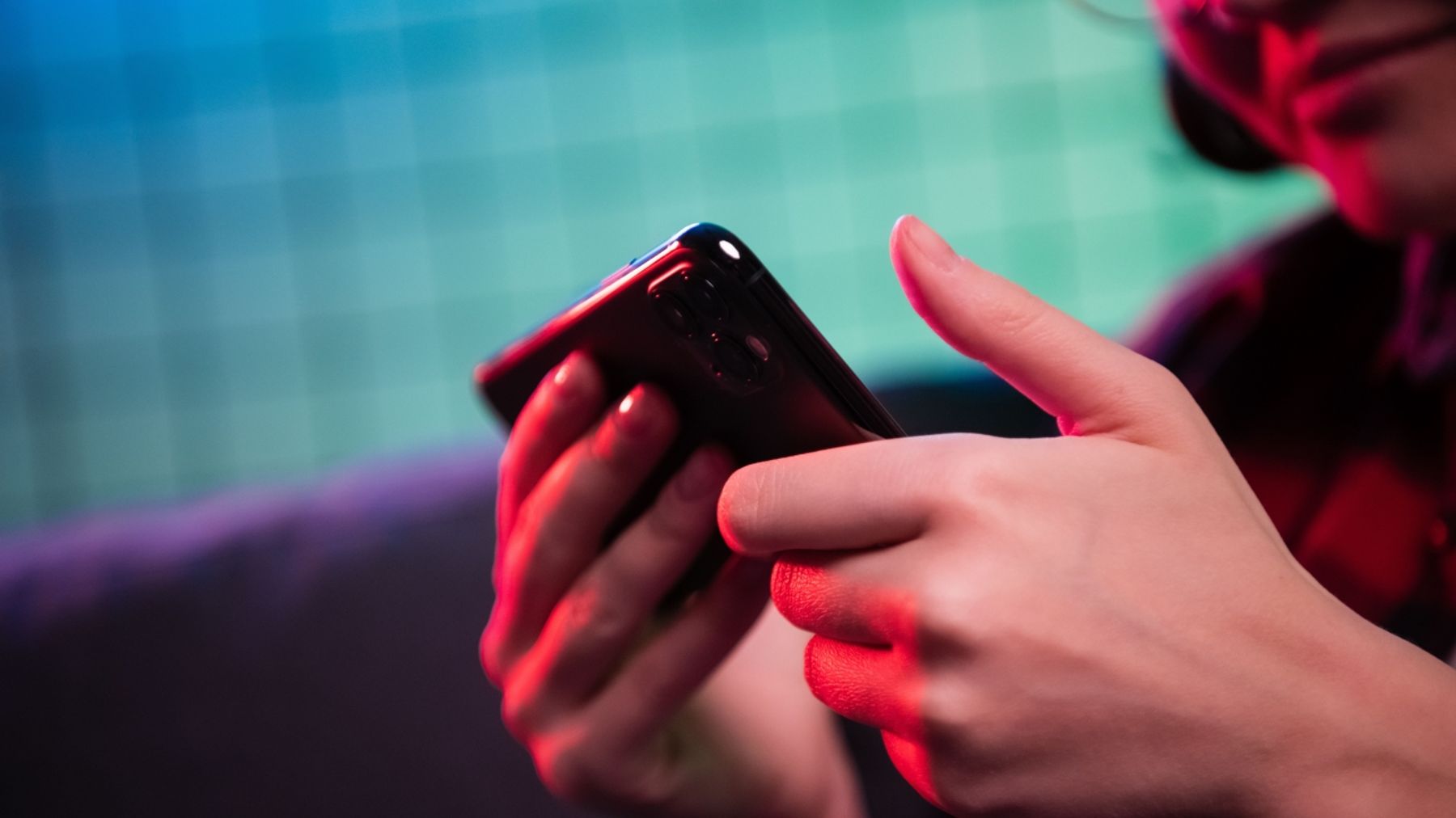 Person scrolling on their phone