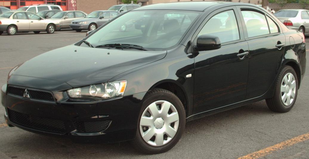 Black 2008 Mitsubishi Lancer sedan photographed in Montreal