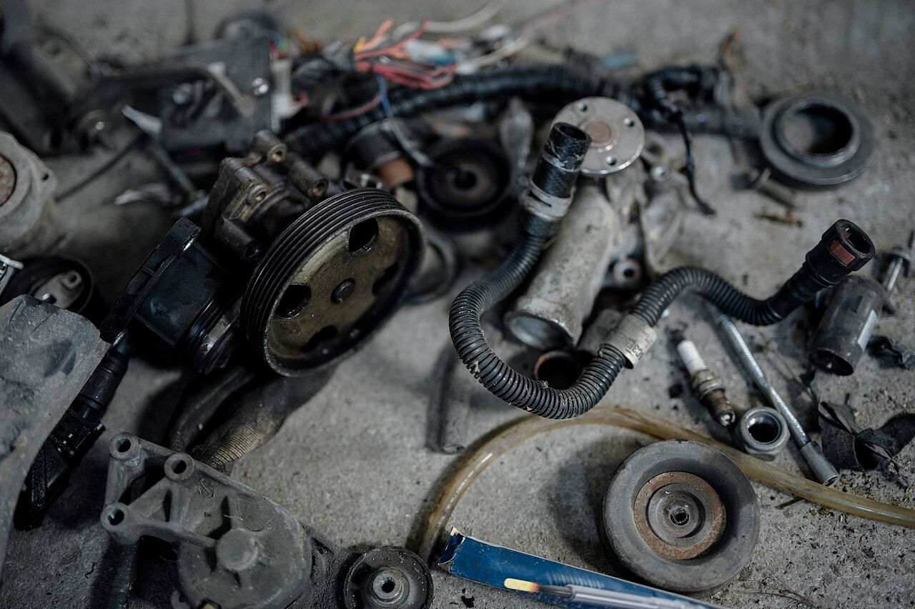 Car parts and tools during workshop maintenance; general inspection illustration