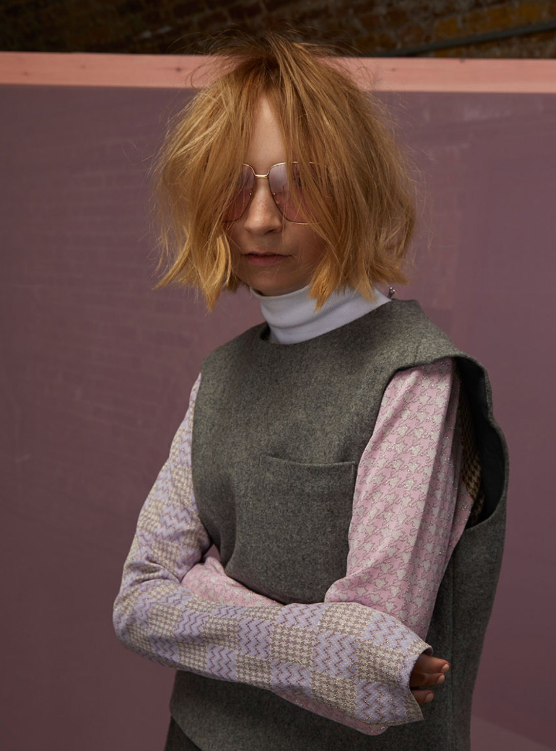 Model with a choppy, textured blonde bob