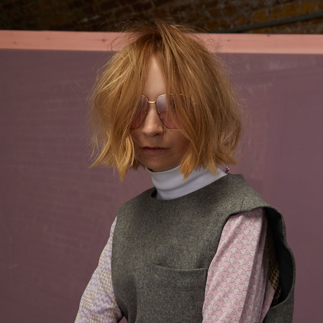 Model with a choppy, textured blonde bob