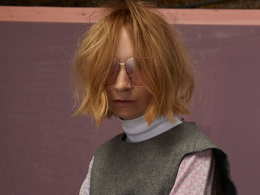 Model with a choppy, textured blonde bob