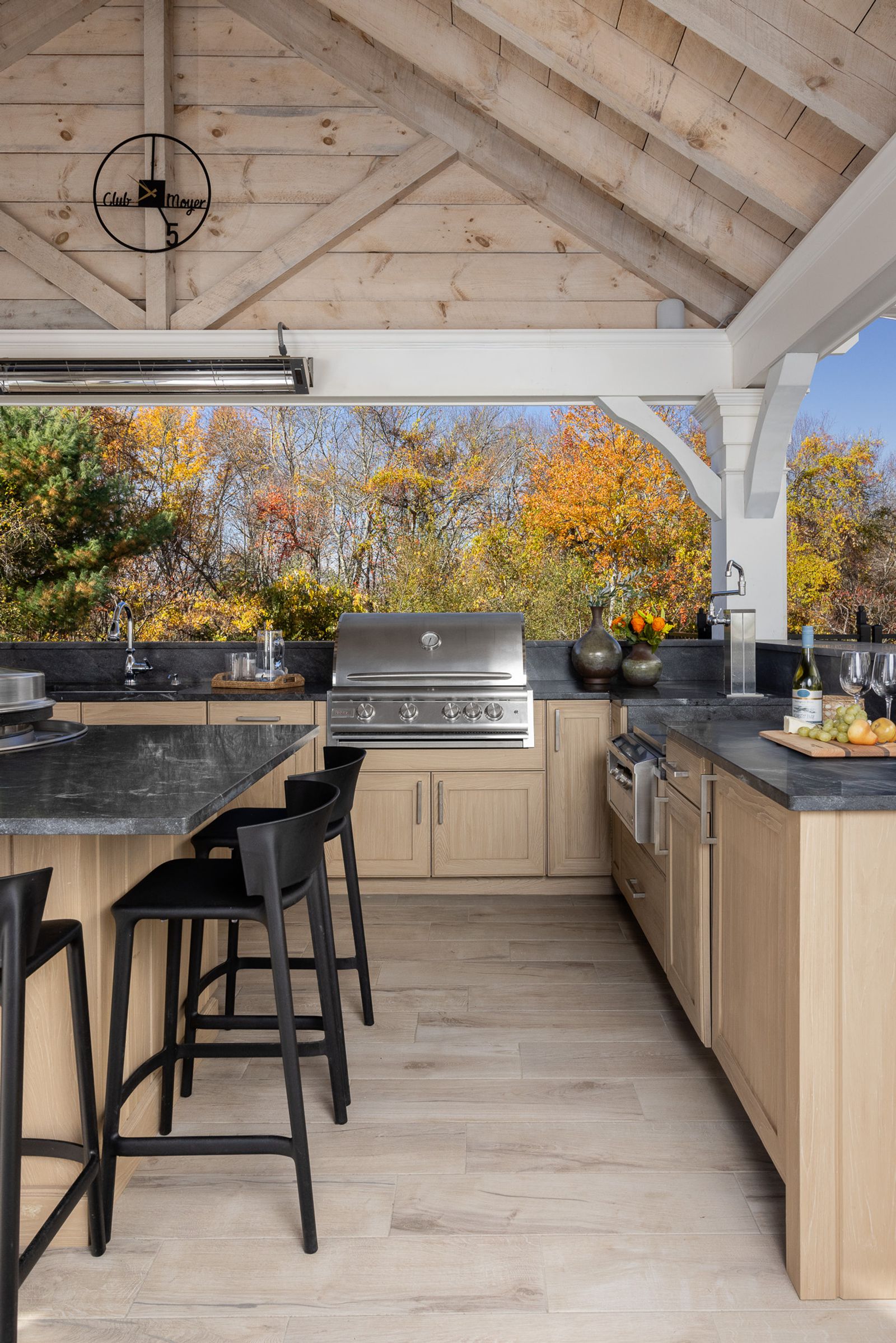 outdoor kitchen with griddle cook top and gas grill