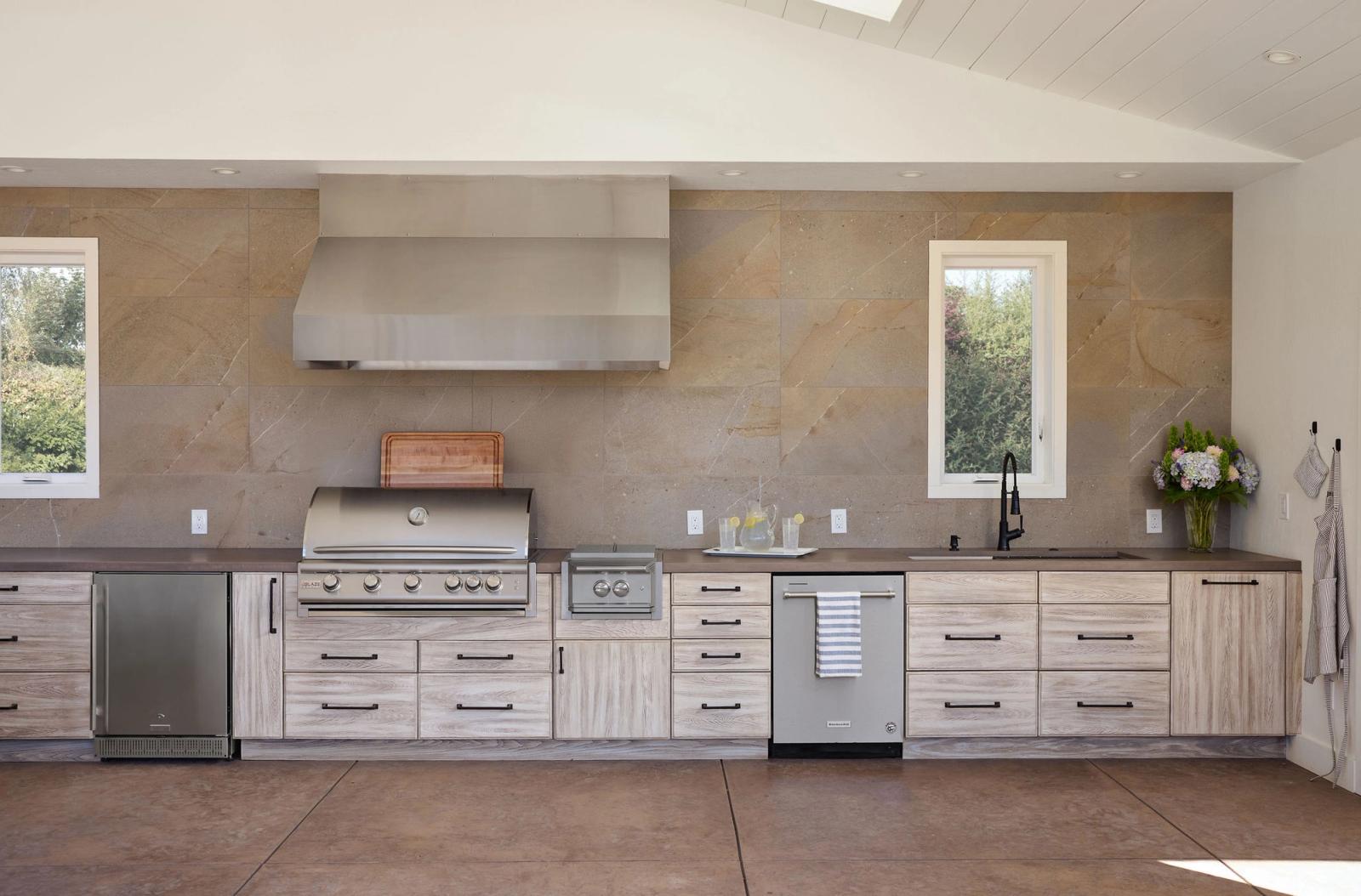 whitewashed oak outdoor cabinetry with built-in grill in california
