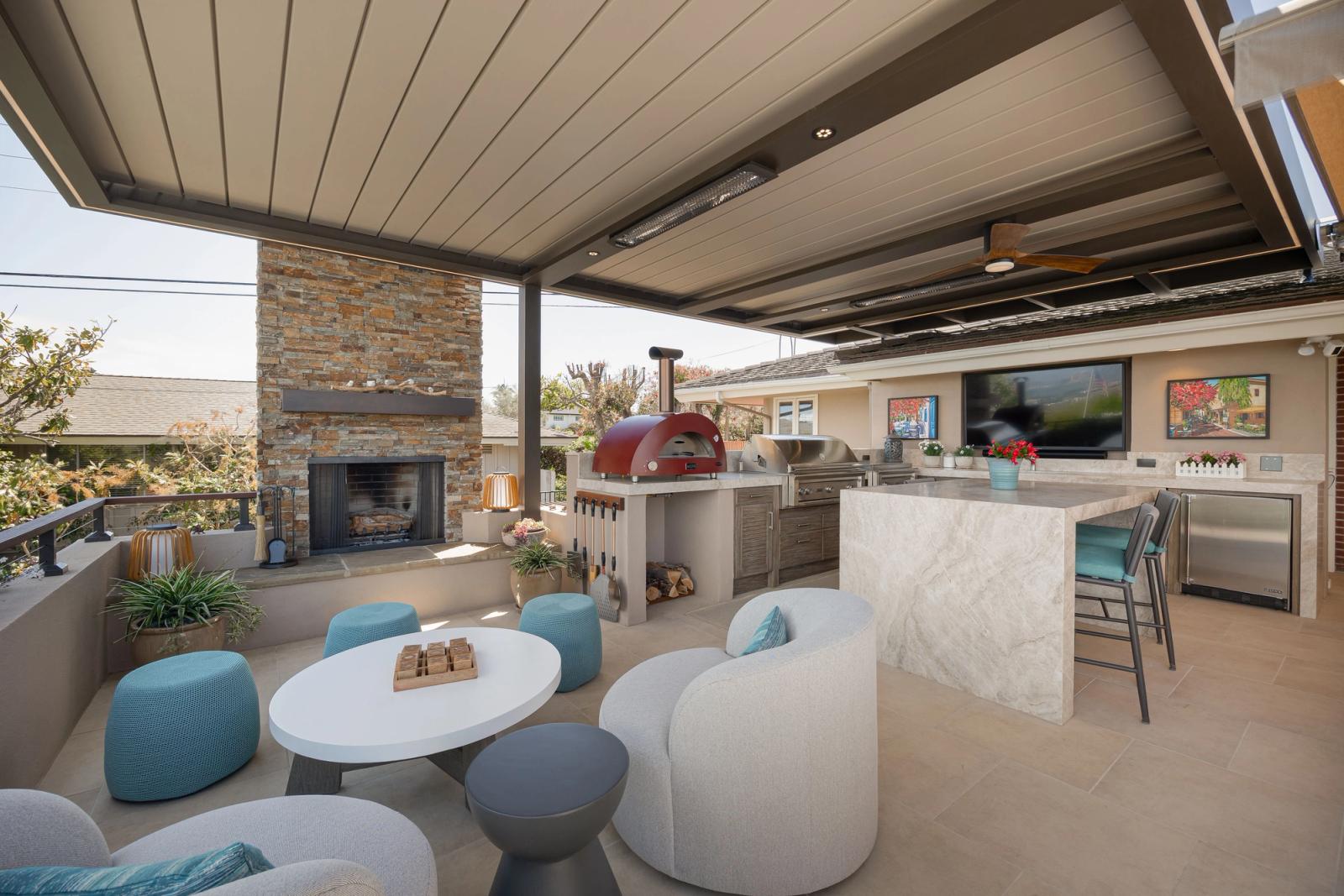covered outdoor living space with lounge seating and outdoor kitchen