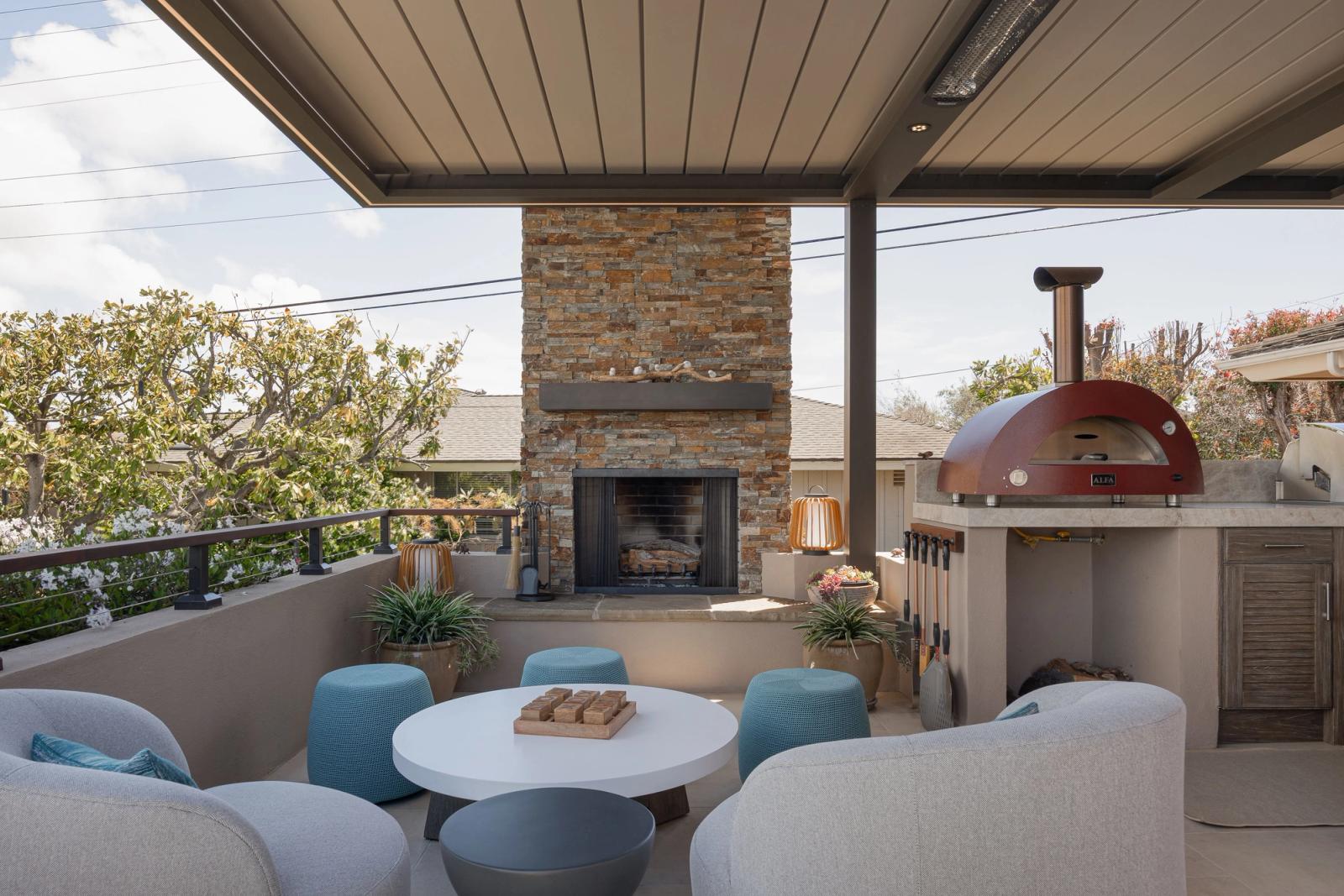 outdoor living area with fireplace and entertaining space san diego