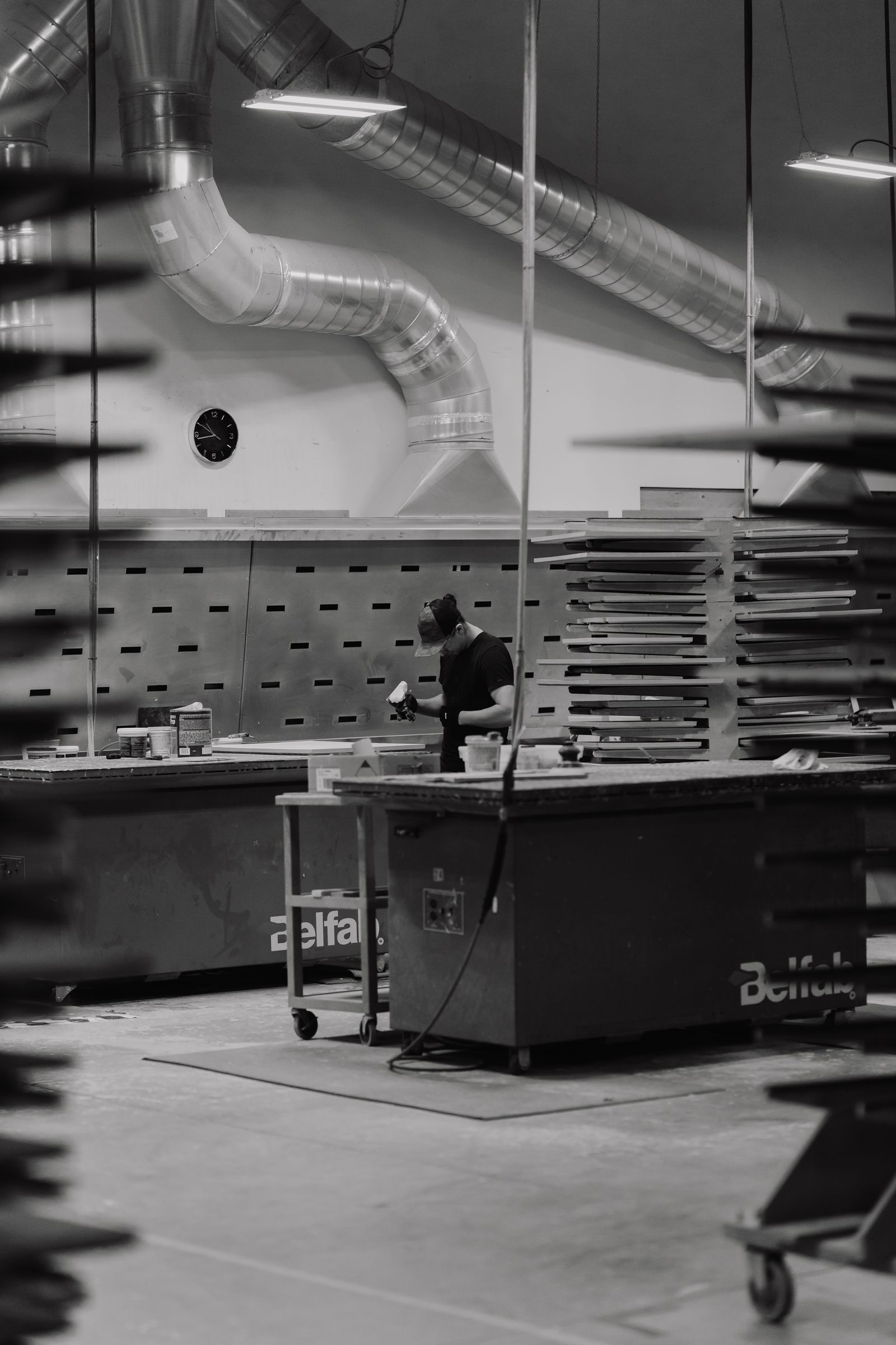 NatureKast workshop with racks of cabinet doors