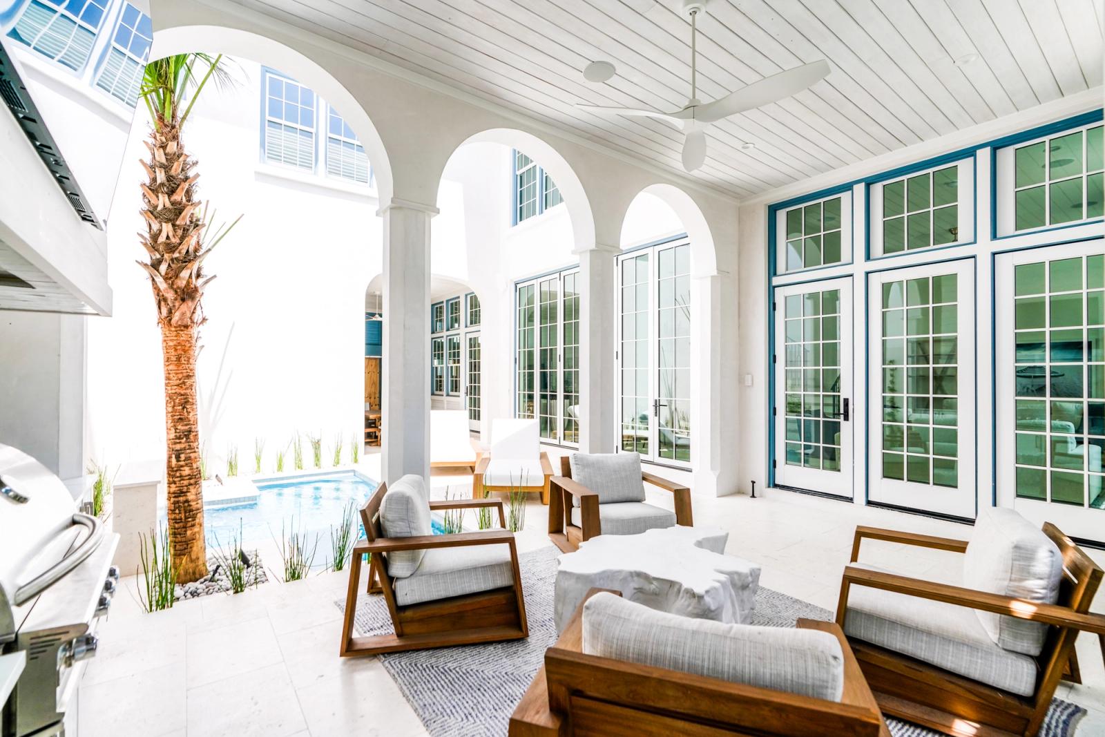 white lanai with outdoor kitchen built in grill