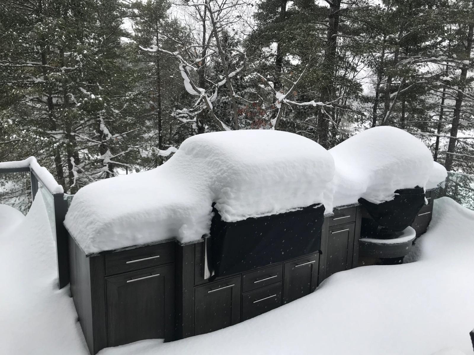 snow covered weatherproof outdoor kitchen in muskoka