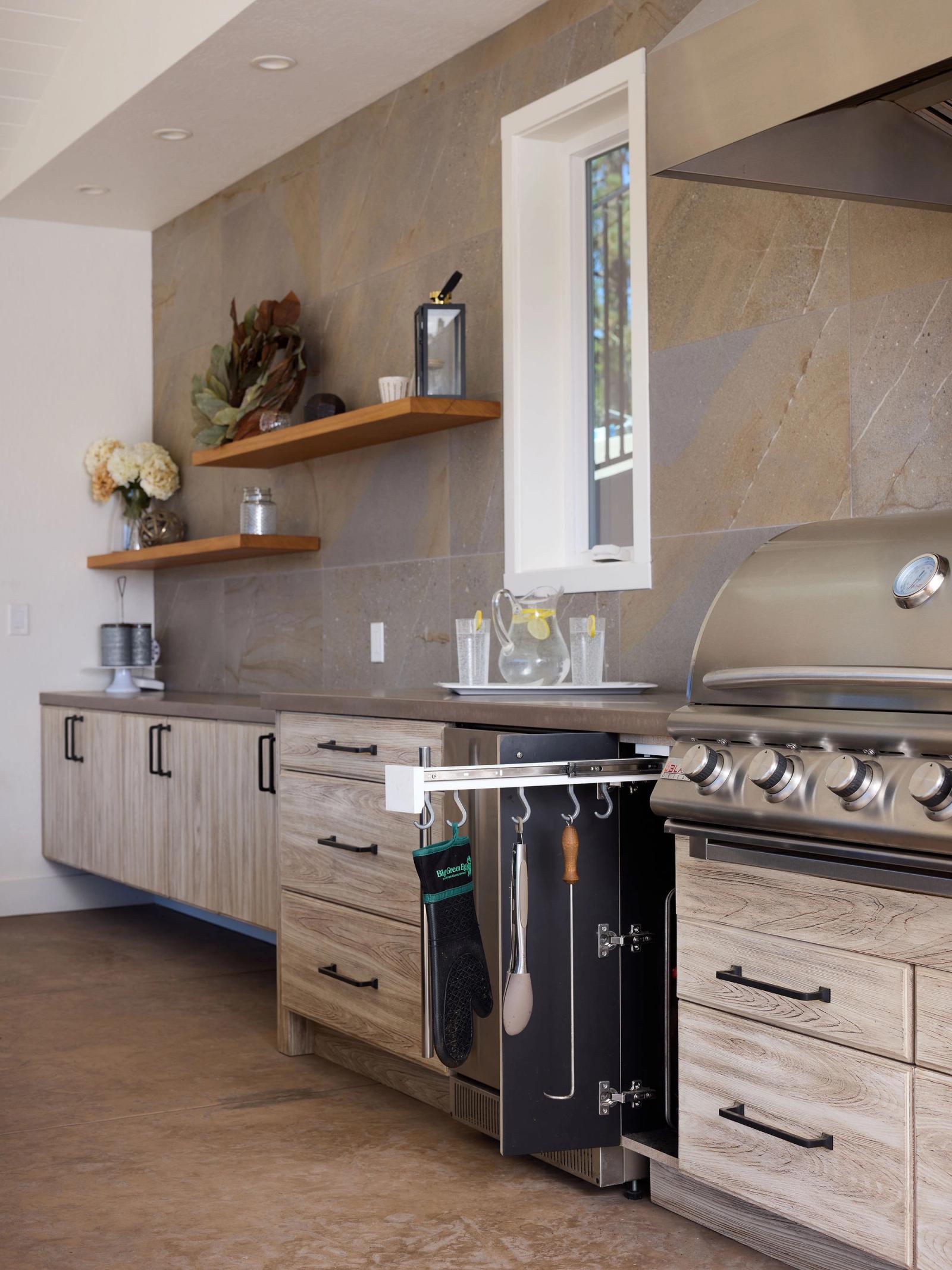 Driftwood toned cabinetry with pull-out storage