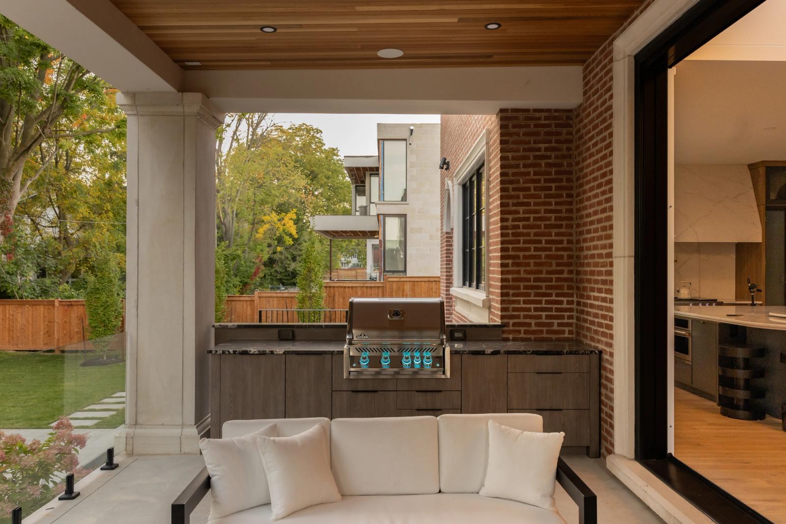 covered porch outdoor kitchen in contemporary slab door with built in grill