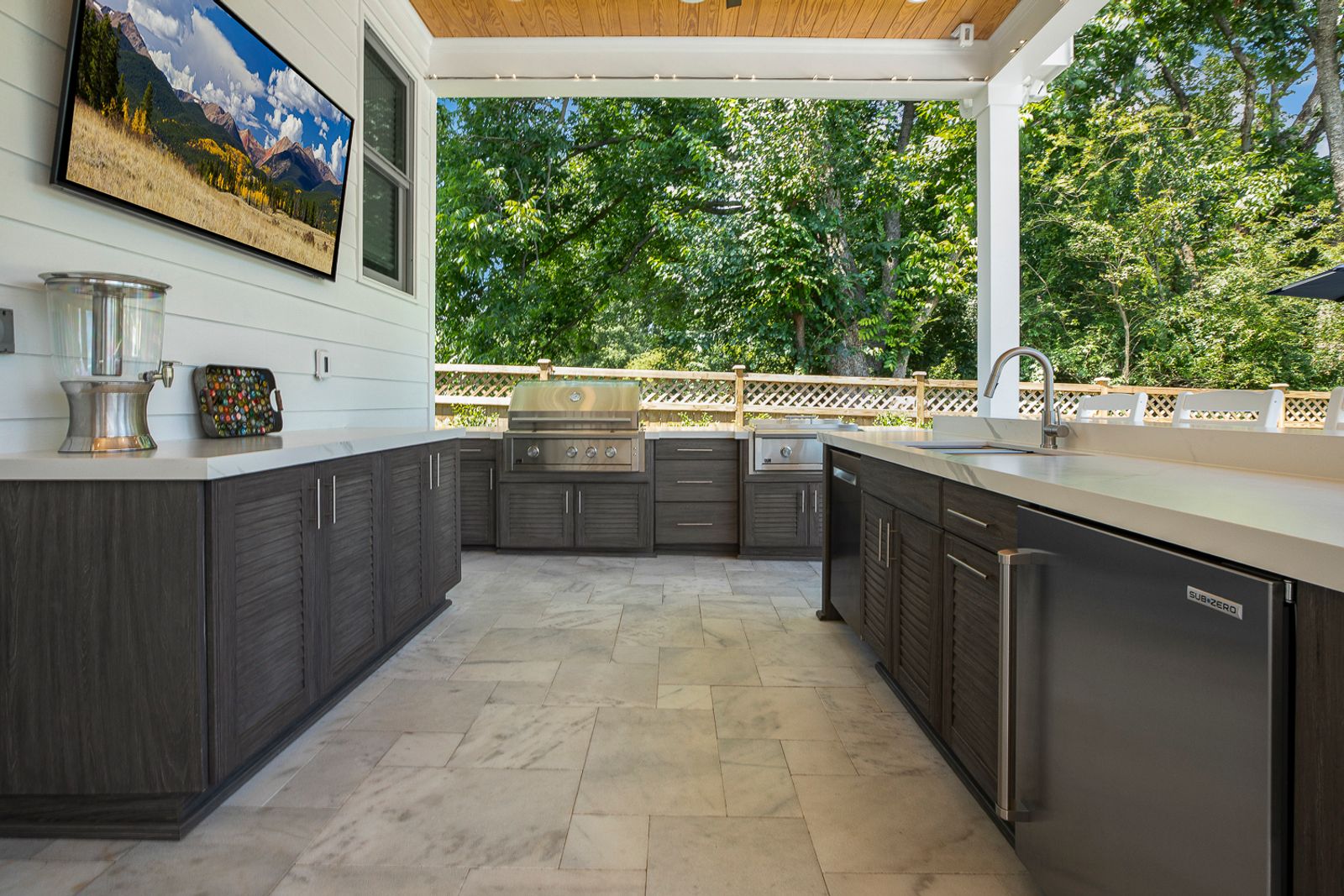 large outdoor kitchen galley with louvered cabinetry