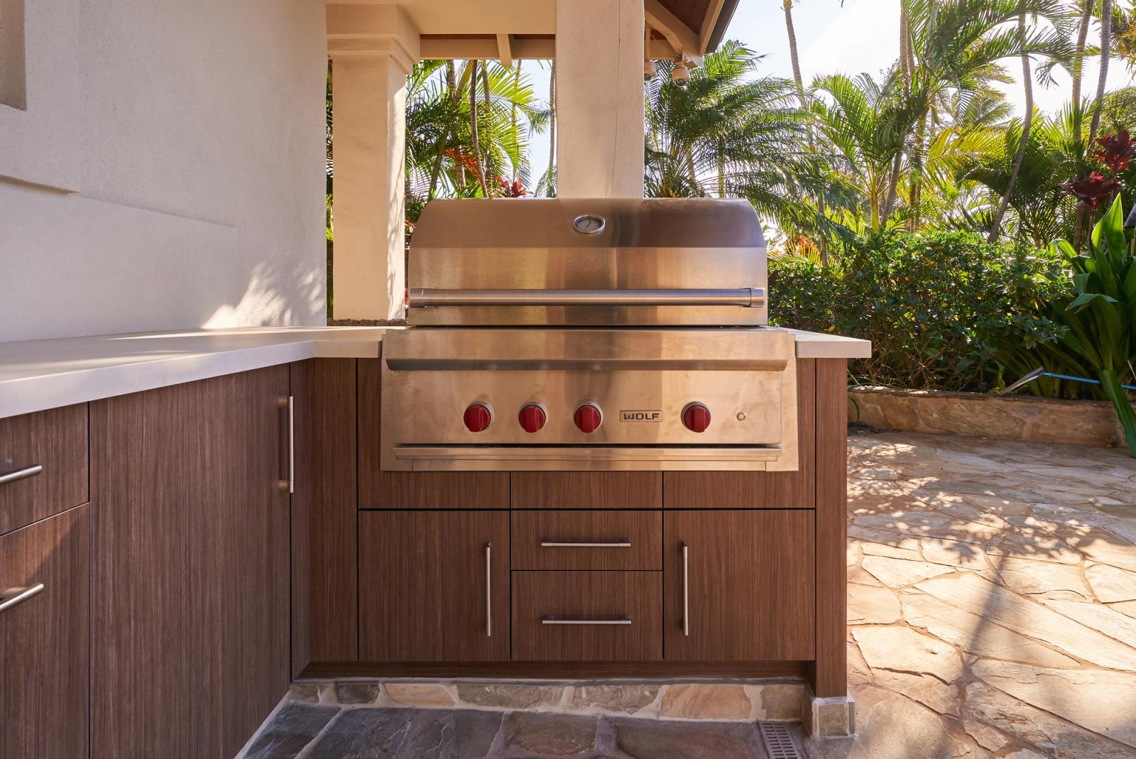 modern slab door outdoor kitchen with built in grill in hawaii