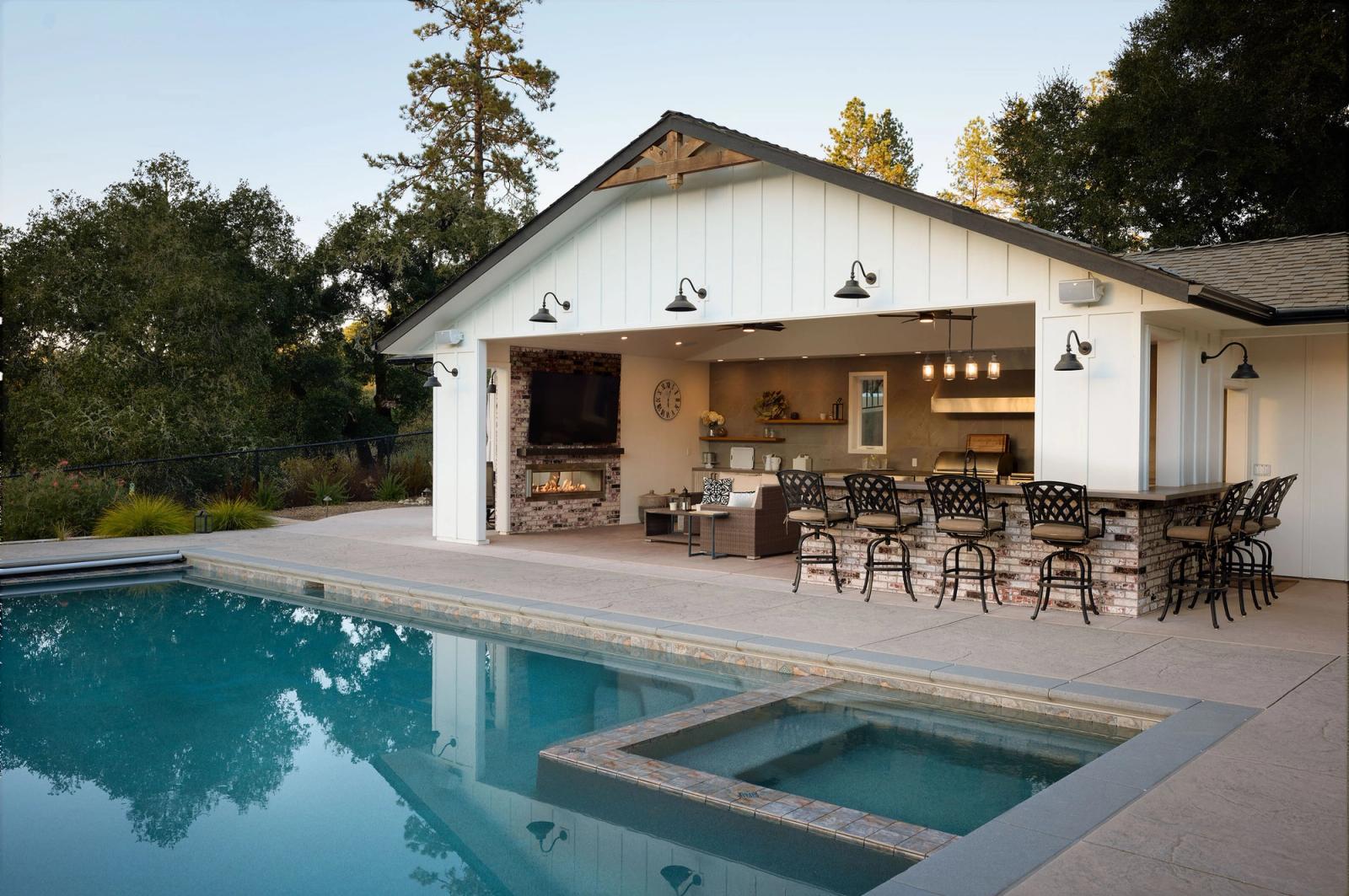modern farmhouse pavilion kitchen with bar and outdoor kitchen