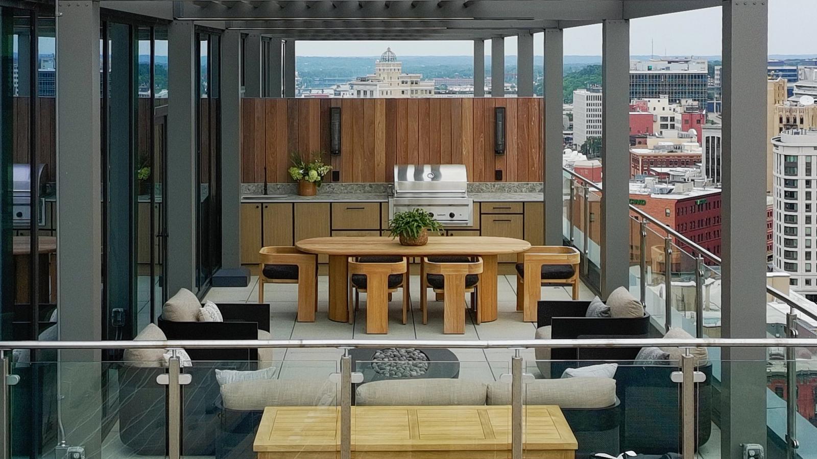 Outdoor kitchen on a city balcony with skyline views