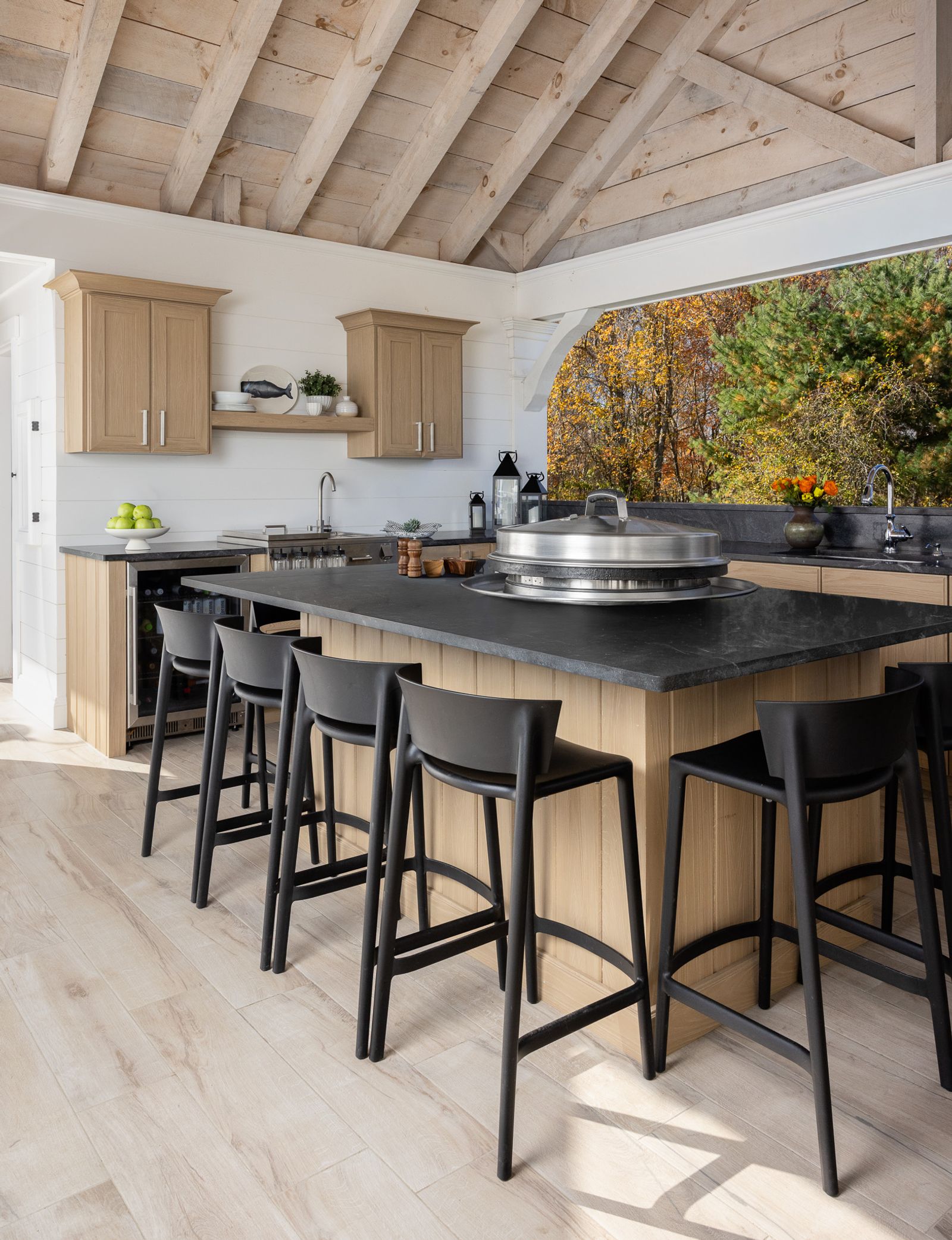 outdoor kitchen island with evo griddle and bar seating