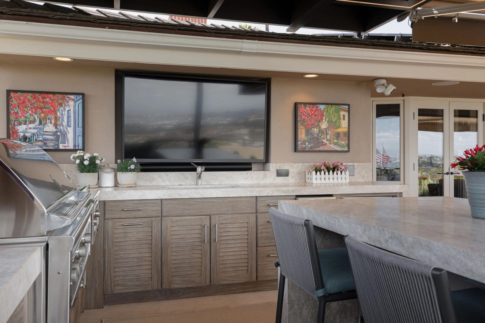 weathered louvered cabinets with stainless steel grill and sink