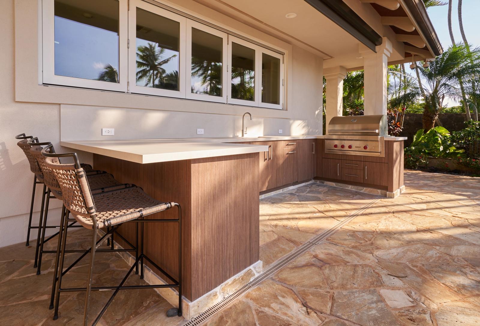 modern walnut toned outdoor kitchen with grill and sink