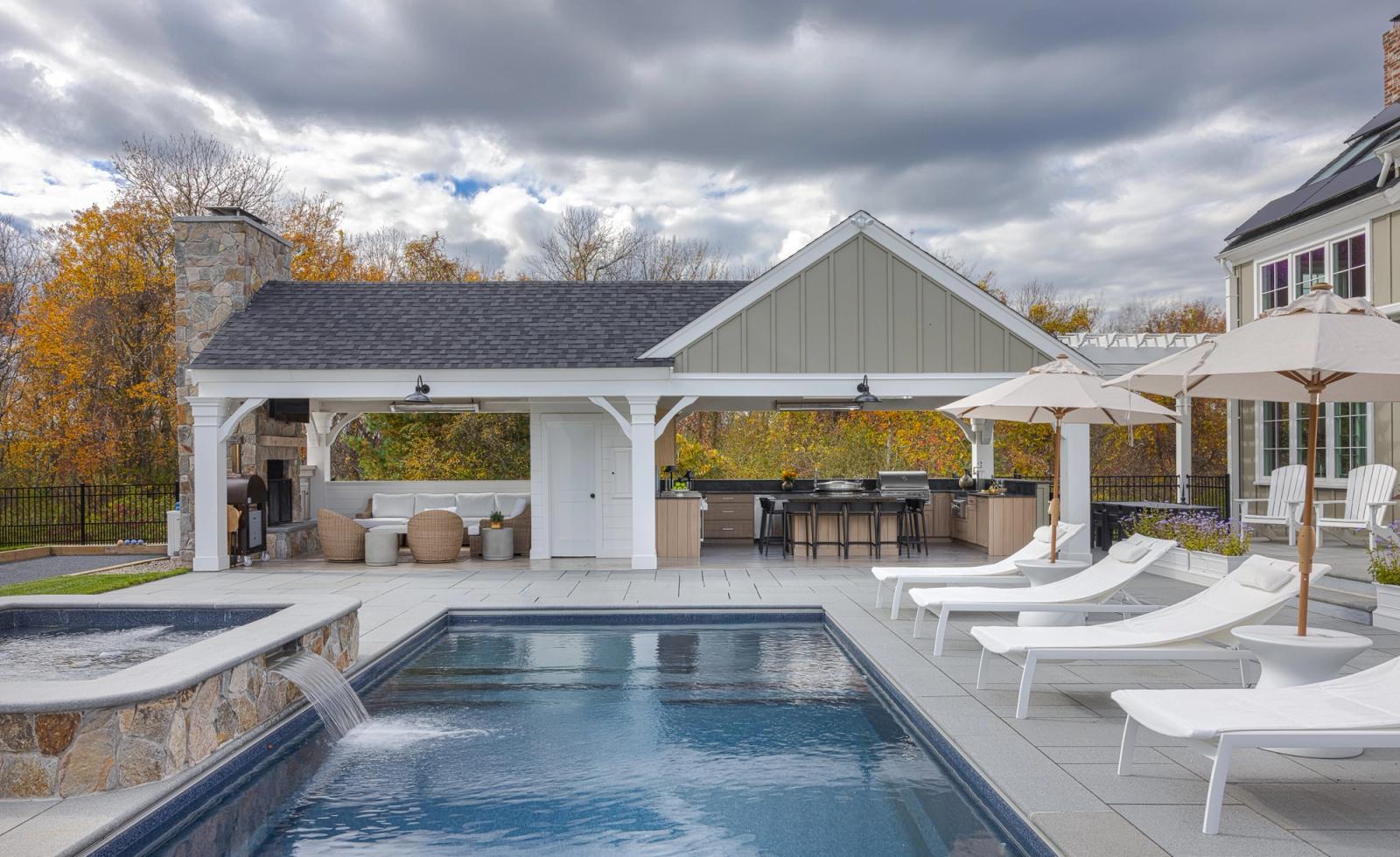 poolside pavilion with outdoor kitchen in new england