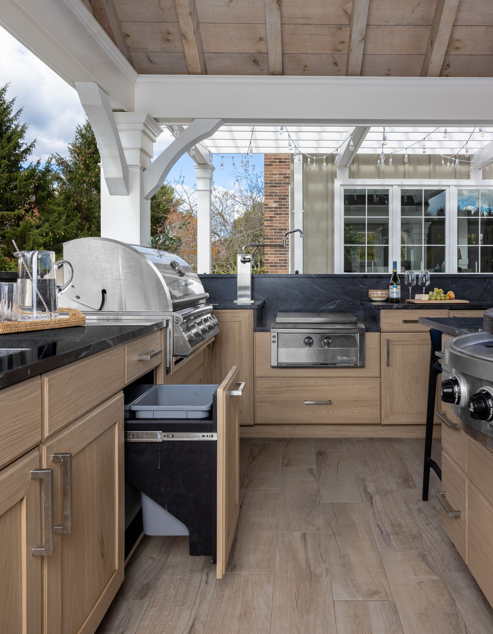 outdoor kitchen oakkast cabinets with dark stone counters