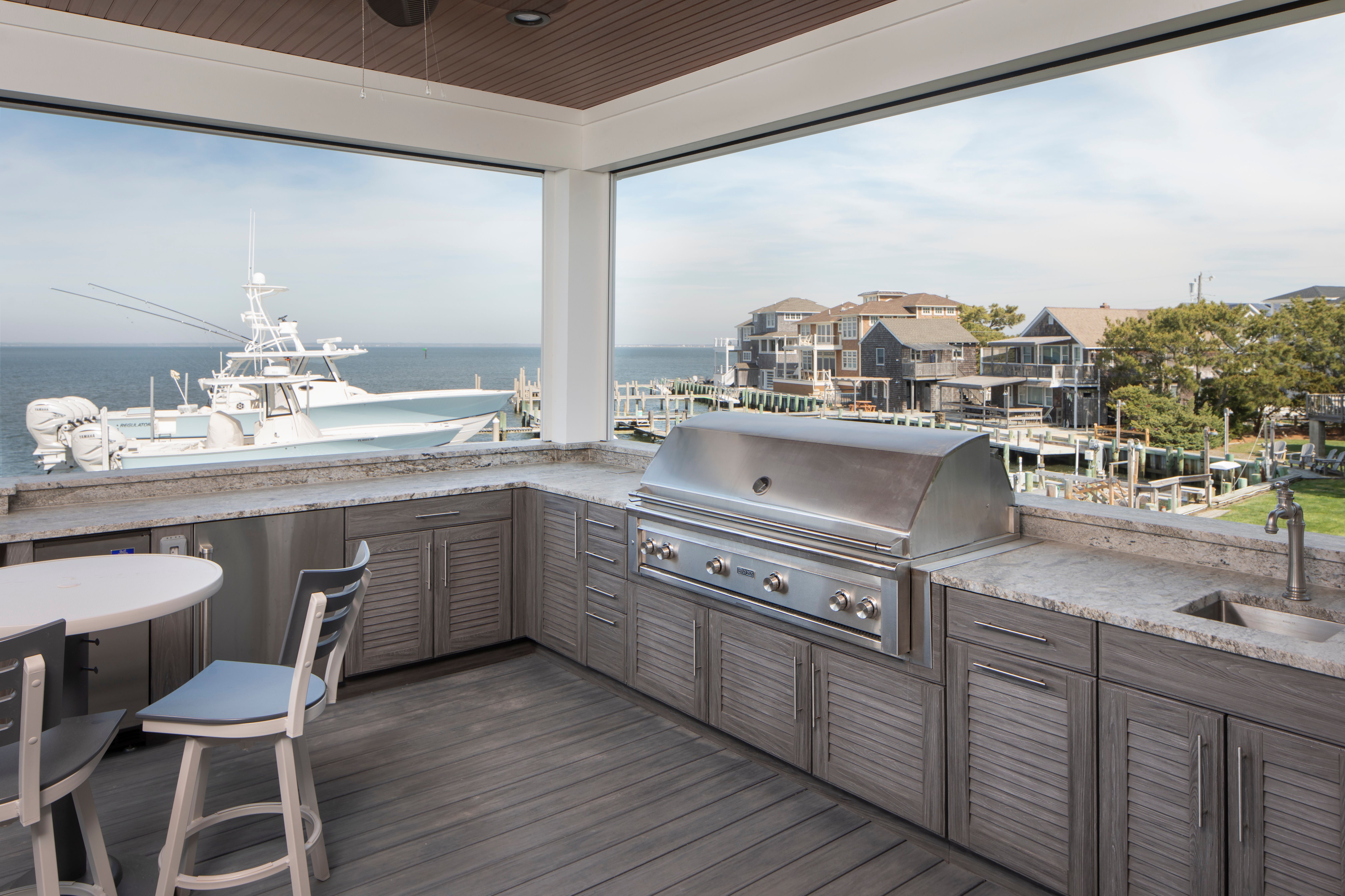 grey outdoor kitchen with louvered door ocean front