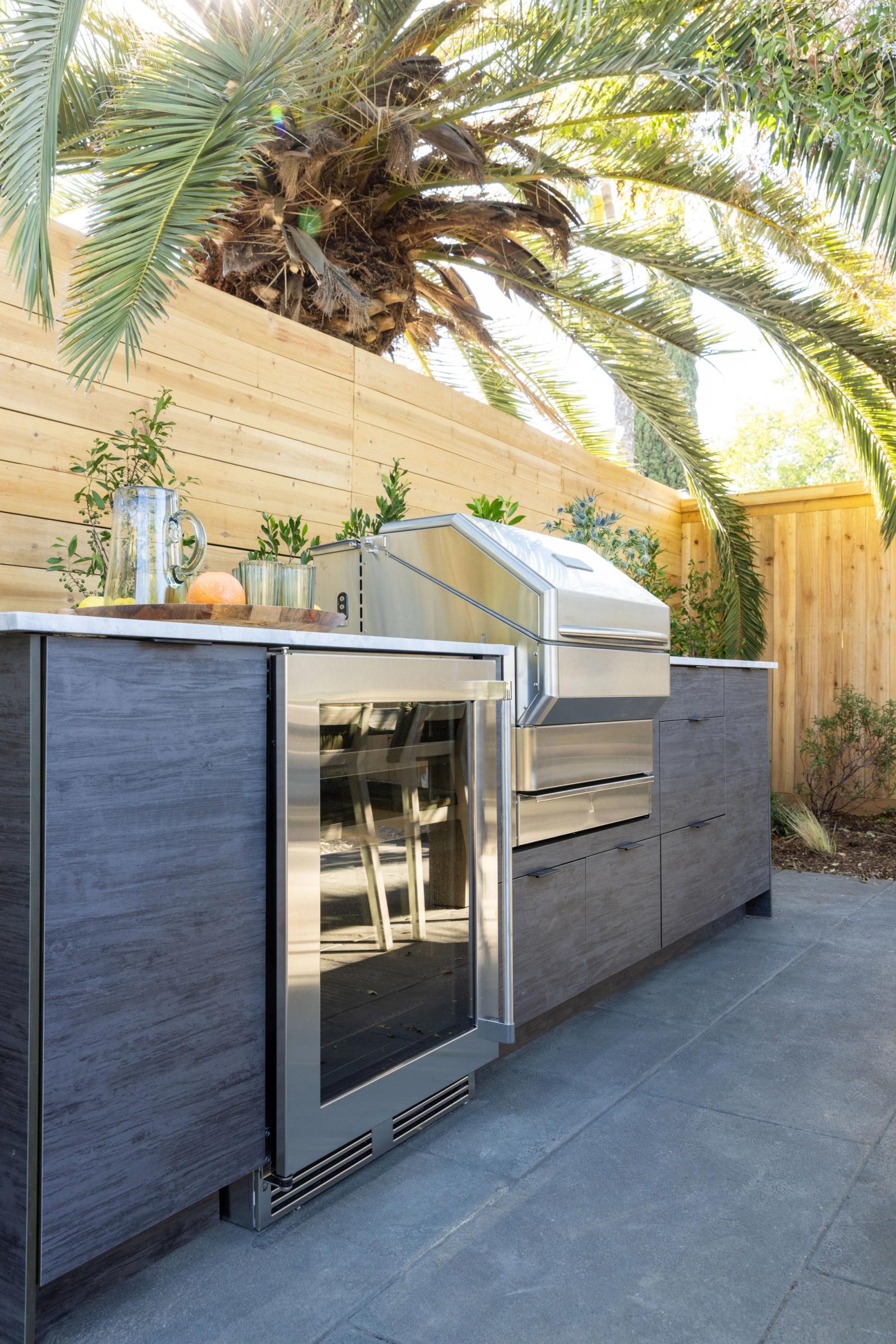 modern outdoor kitchen with grey slab door in california