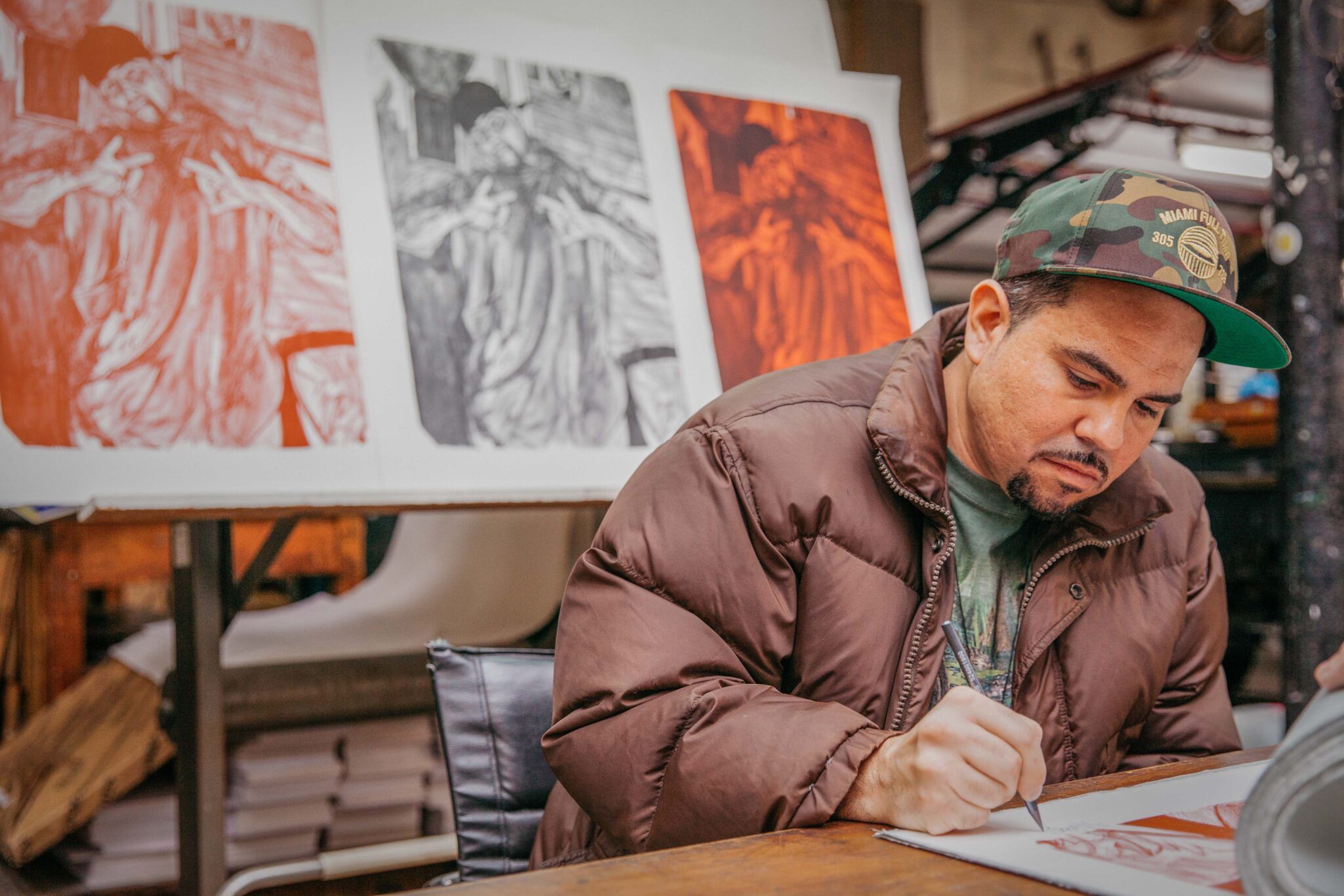 Michael Vasquez is working in his studio