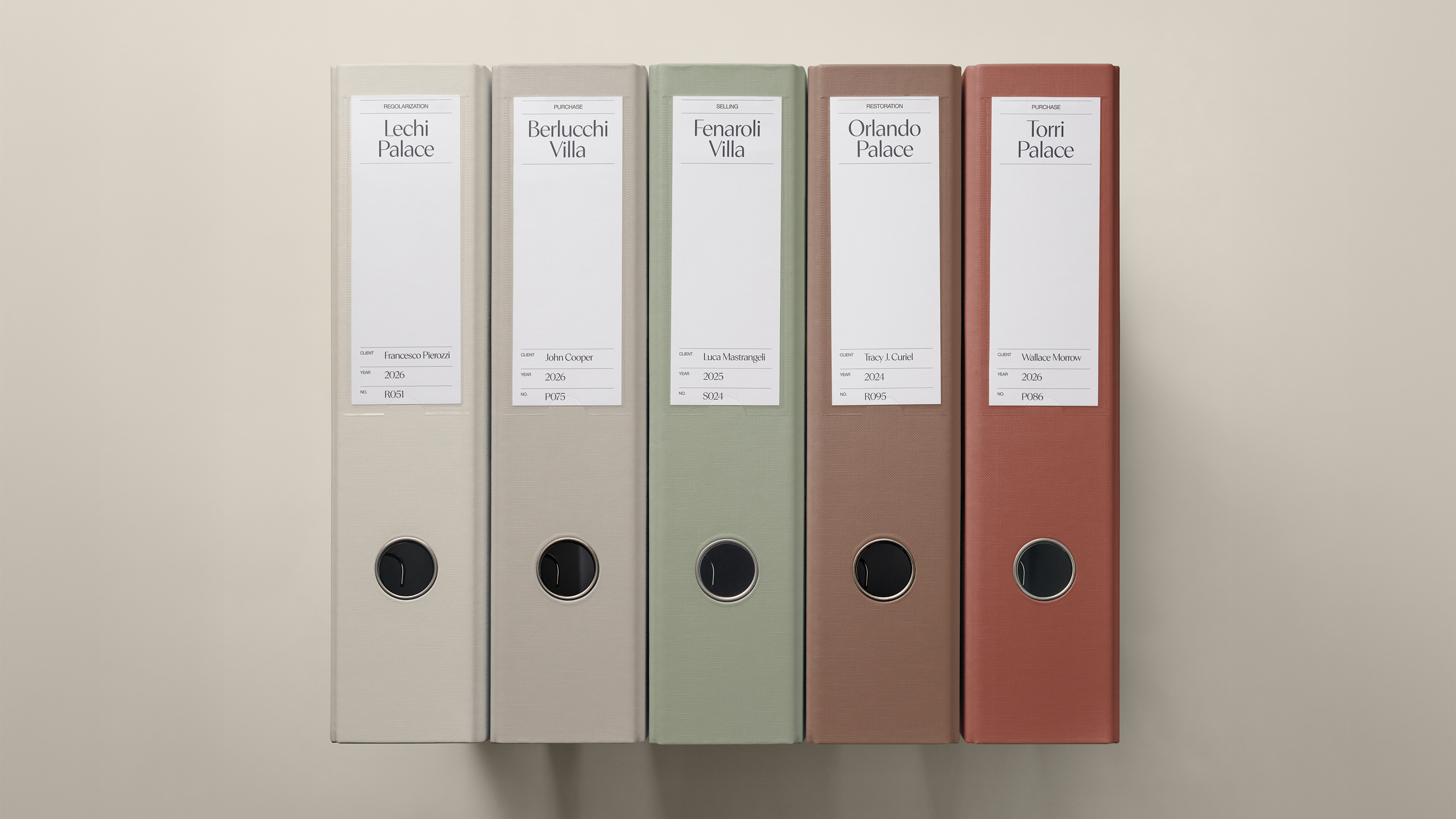 Mondini Studio binders in the brand palette, one per property file