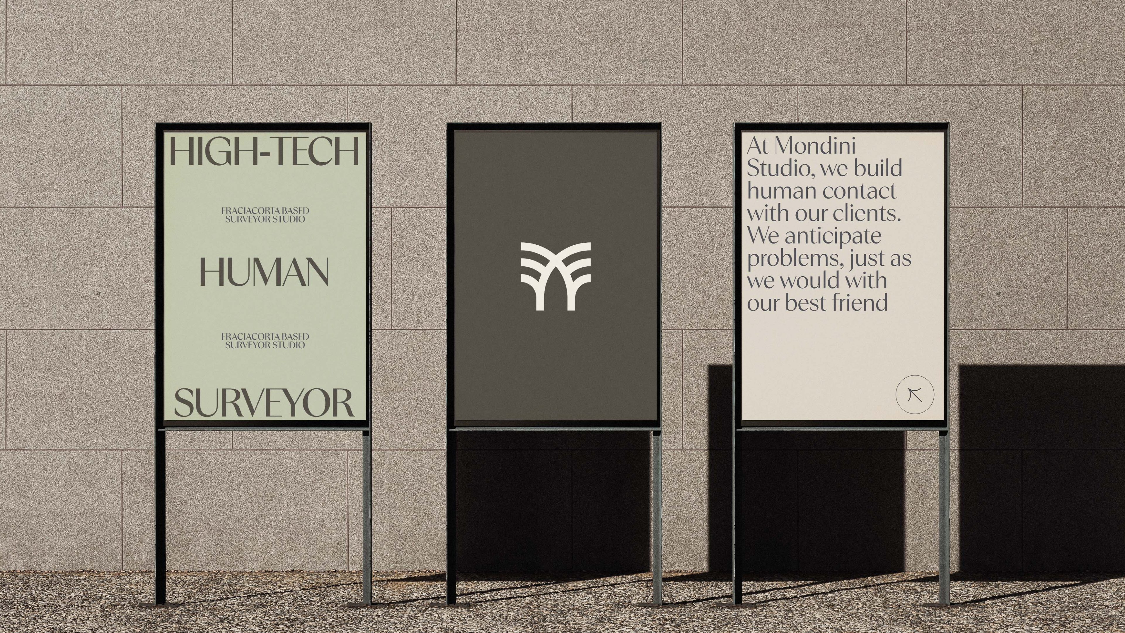 High-Tech Human Surveyor posters and the best friend line on street stands, Mondini Studio brand identity