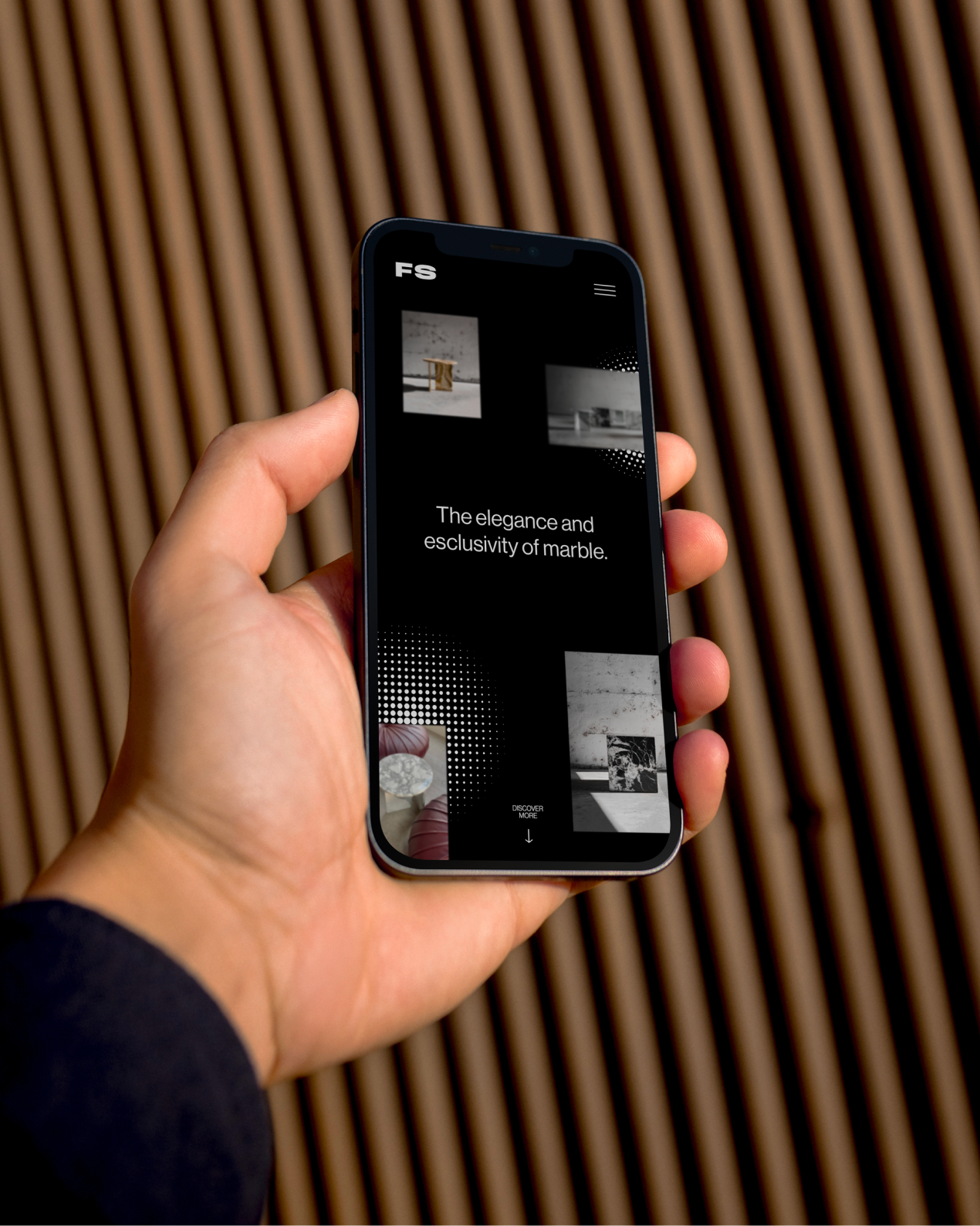 Hand holding a phone displaying the Forme Studio marble furniture website