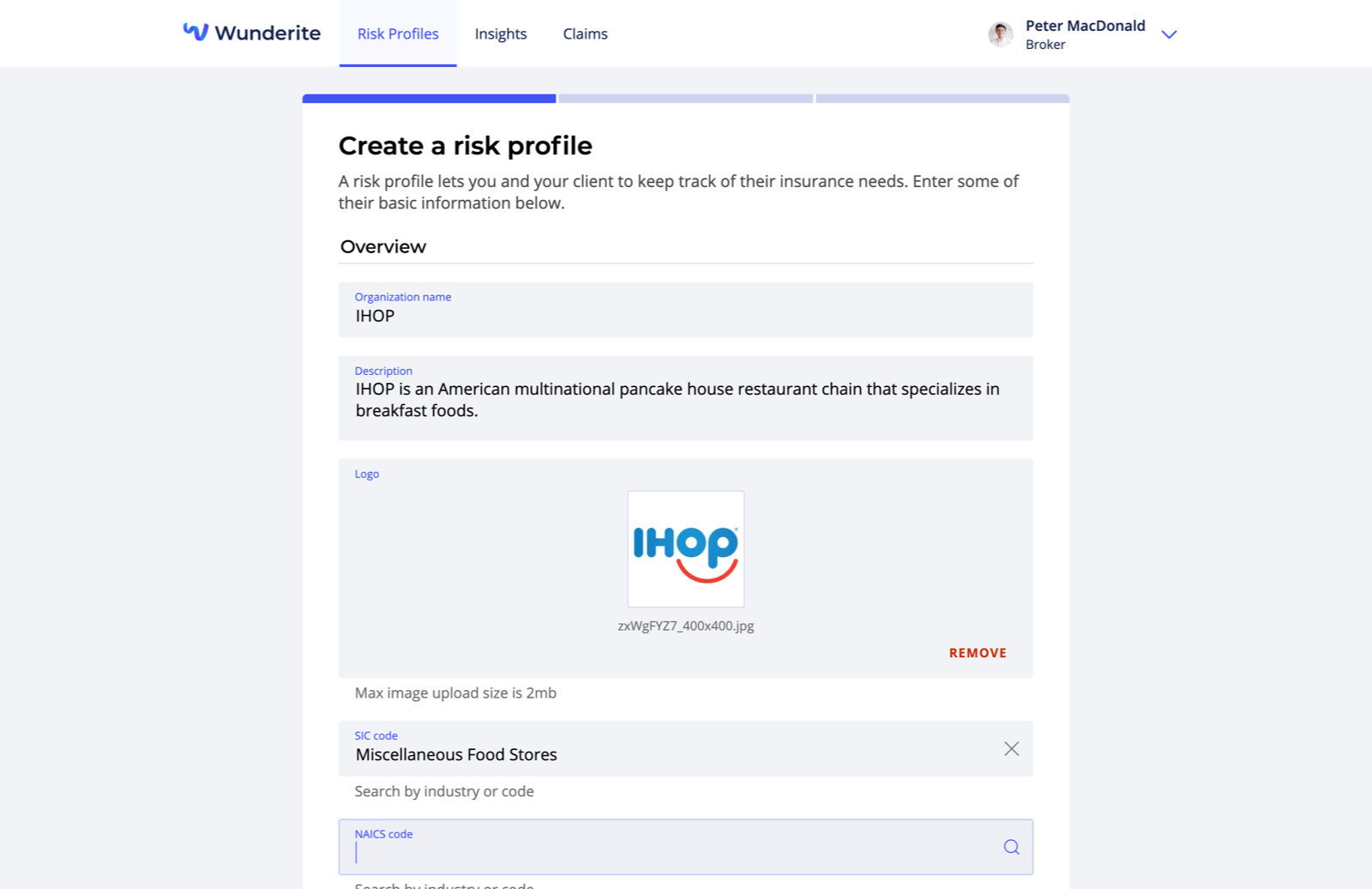 A form for creating a new profile. The fields are organization name (filled "IHOP"), description (filled "IHOP is an American multinational pancake house restaurant chain that specializes in breakfast foods"), logo (filled with IHOP's logo), SIC code (filled "Miscellaneous Food Stores"), and NAICS code (which is currently focused).