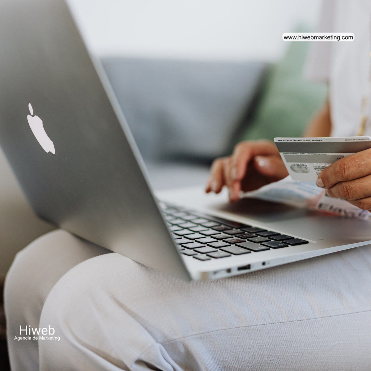 Person making an online purchase using a laptop and bank card, representing e-commerce, digital payments, and online shopping experience within digital marketing strategies, Hiweb.