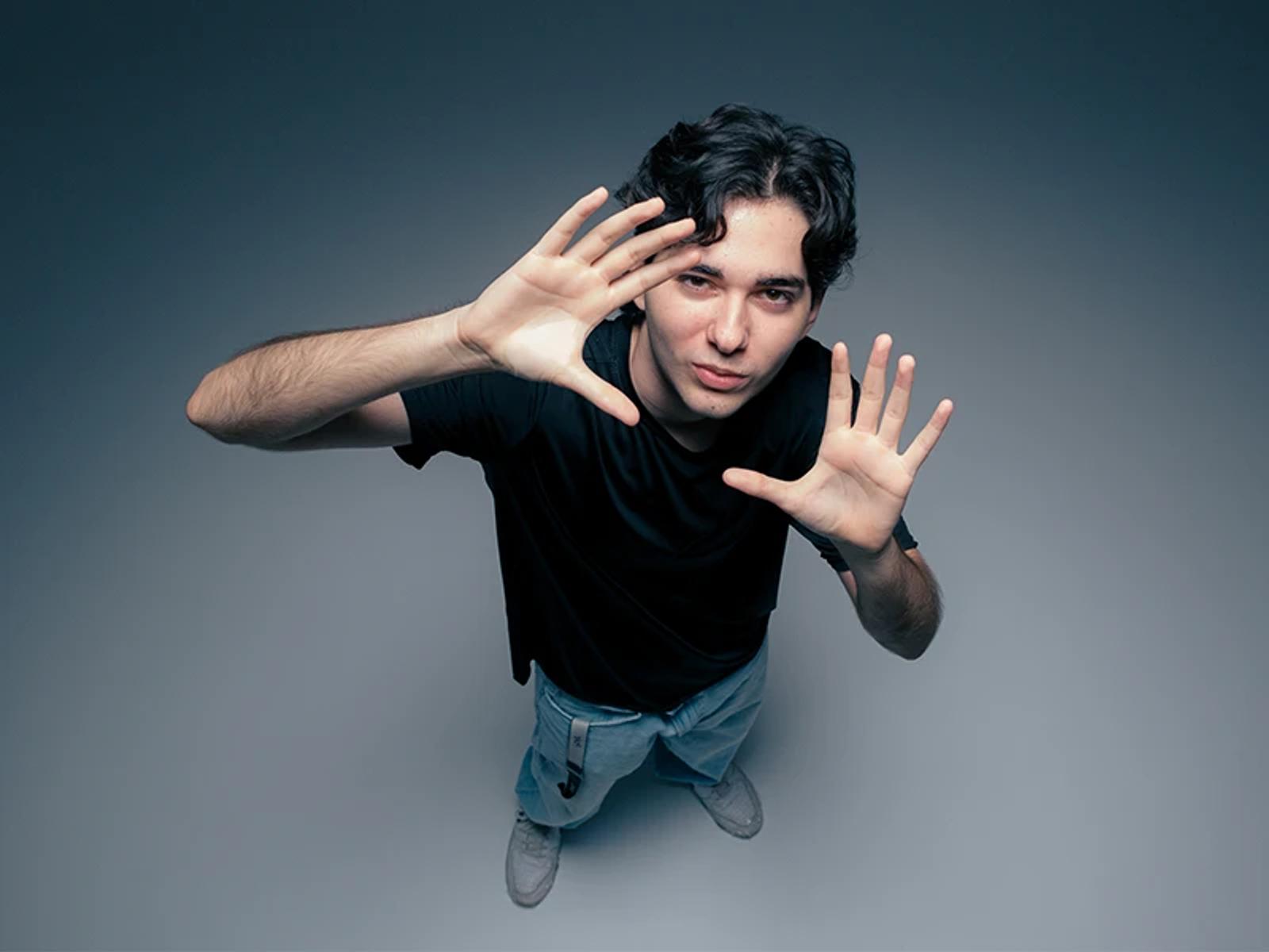 Hiweb team member framing the camera with his hands during a photo shoot