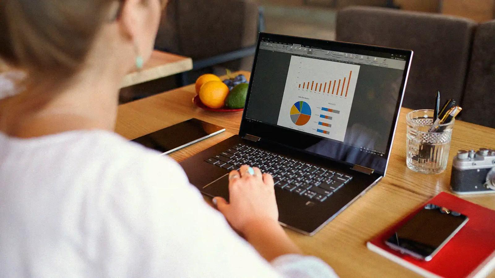 Person working with Google Ads charts on a laptop