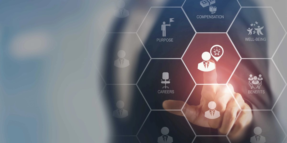A blurred figure in a suit touches a glowing hexagonal interface labeled with employee terms including compensation, well-being, careers, and purpose.