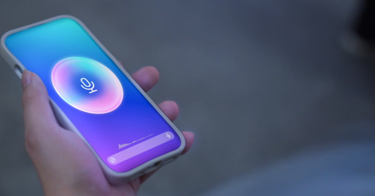 Person holding a phone while speaking into an AI chatbot.