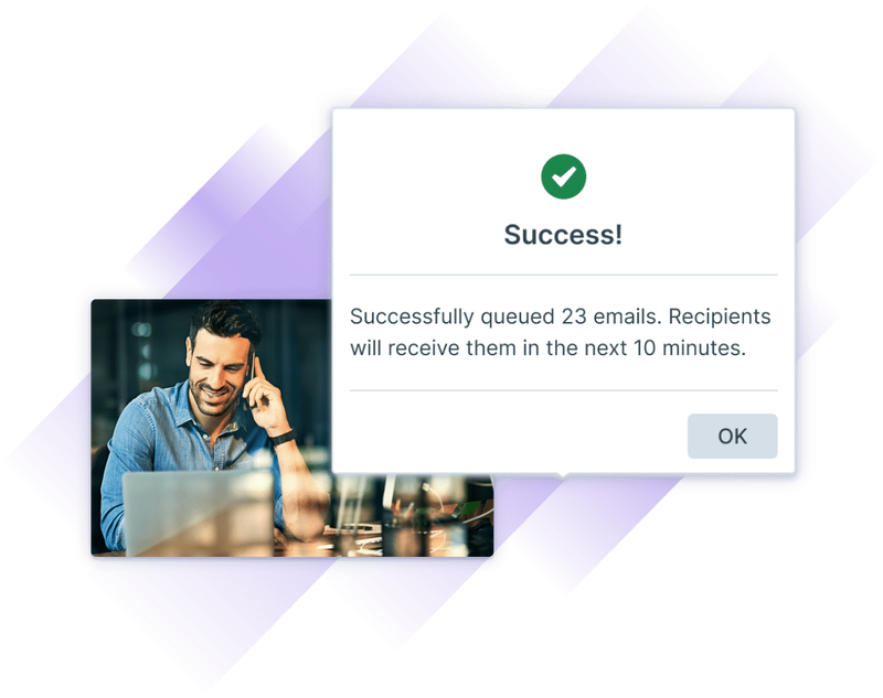 Screenshot showing a training admin seeing their emails get successfully sent to learners on a laptop while they are on the phone.