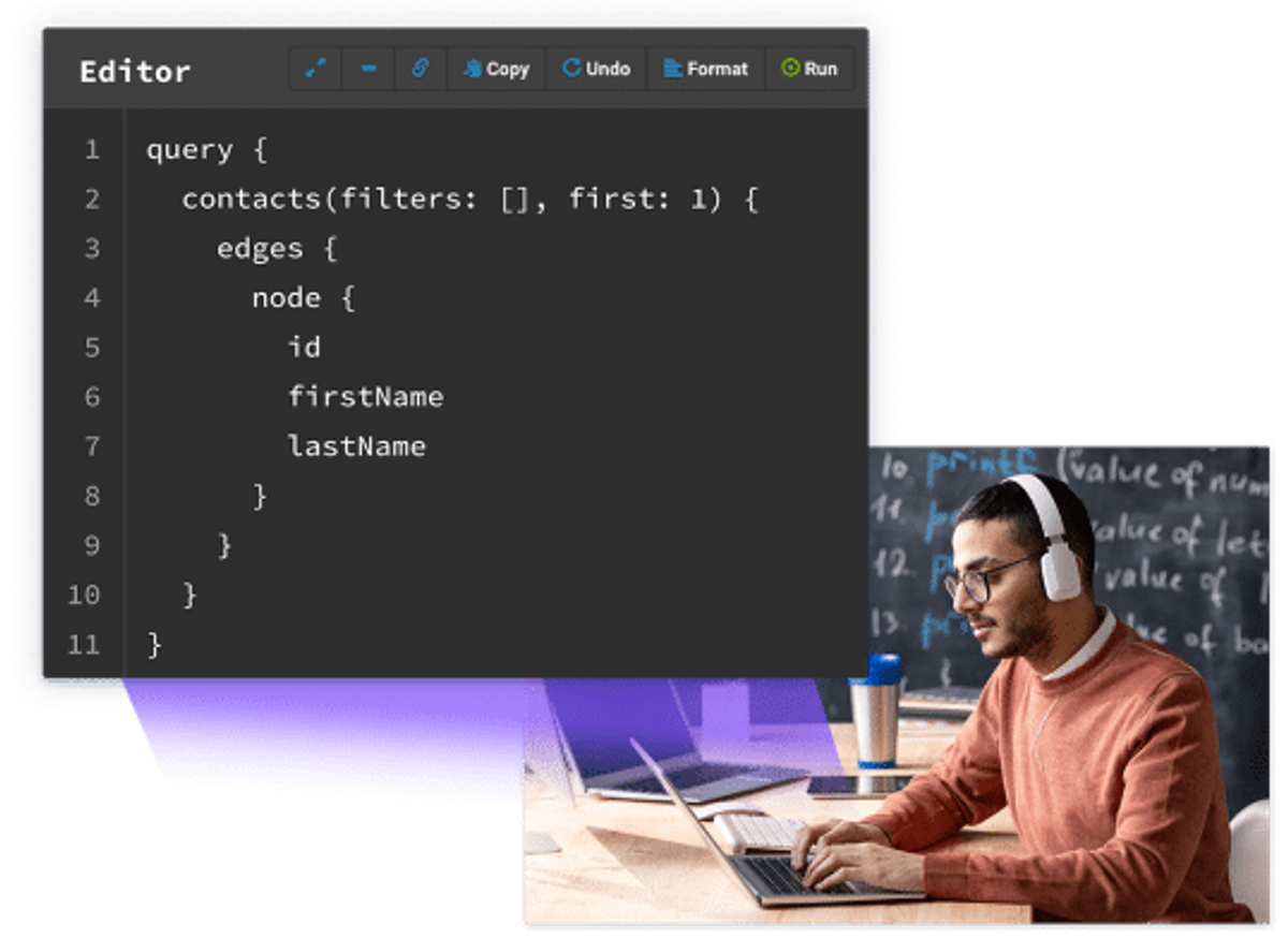 Developer using a code editor for Administrate DX.