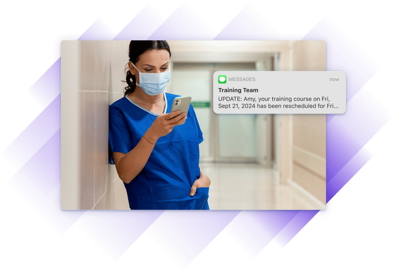 Screenshot of medical professional looking at their phone and reading a notification.