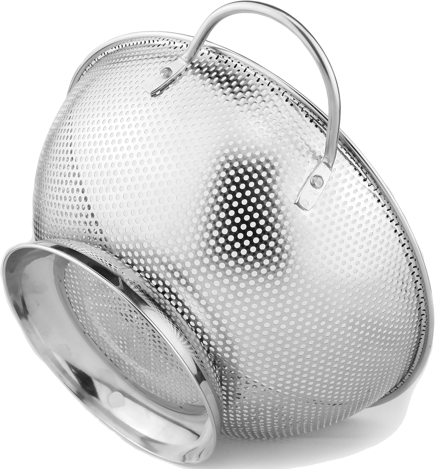 Perforated stainless steel colander with two wire loop handles and a raised ring base, tipped on its side