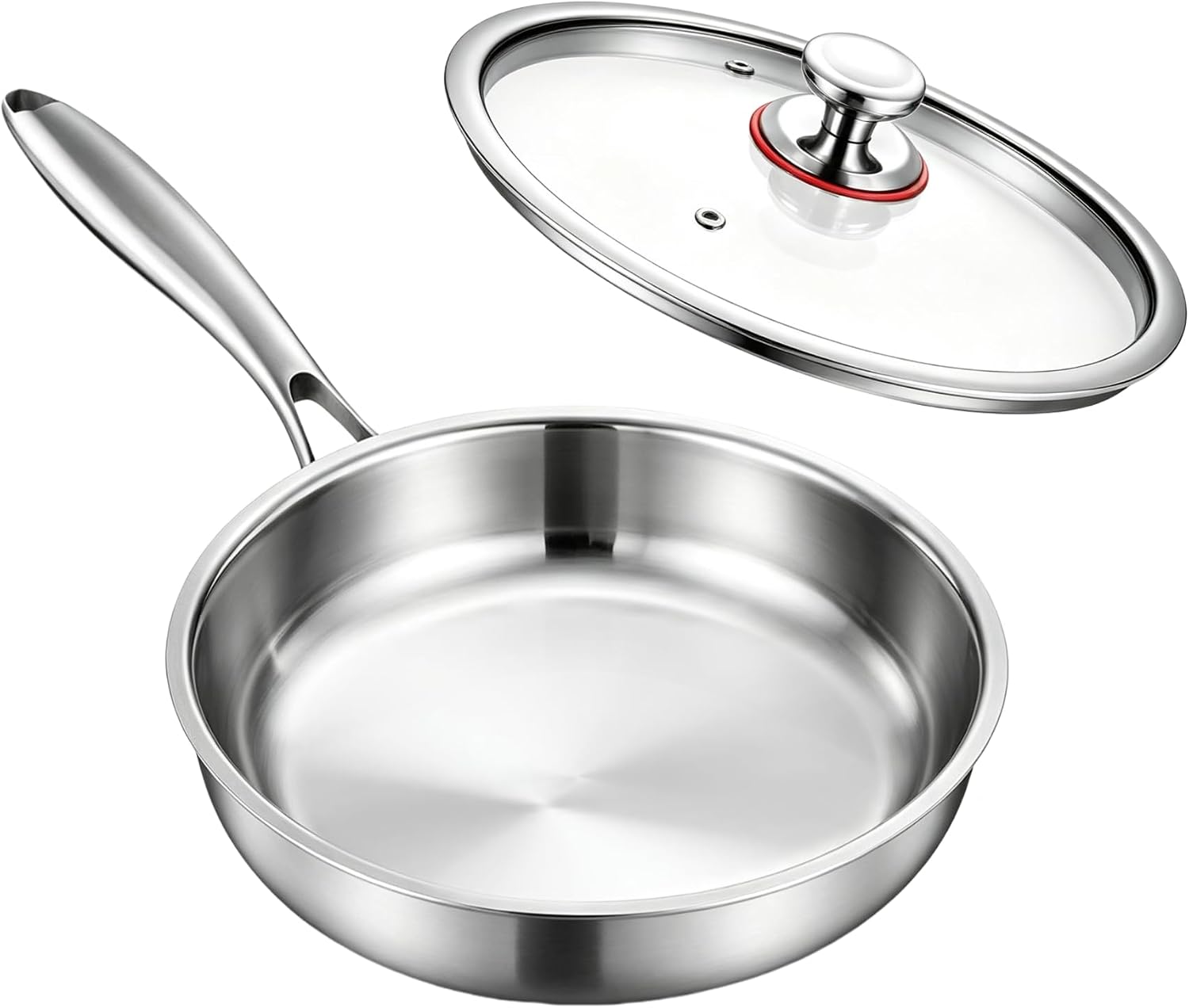 Polished stainless steel skillet with a long handle and a glass lid resting behind it
